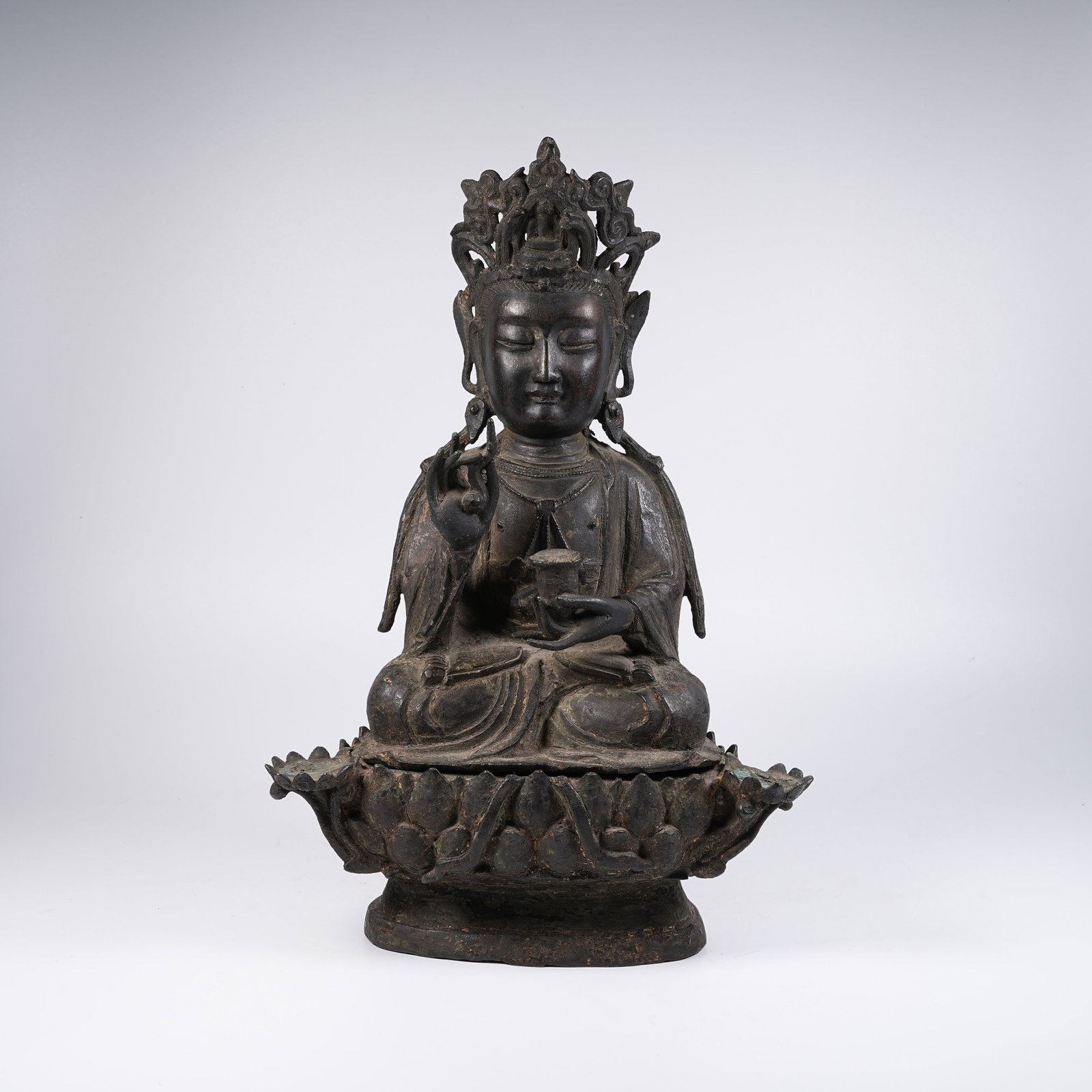 A BRONZE SEATED STATUE OF GUANYIN: Bronze Seated Statue of Guanyin