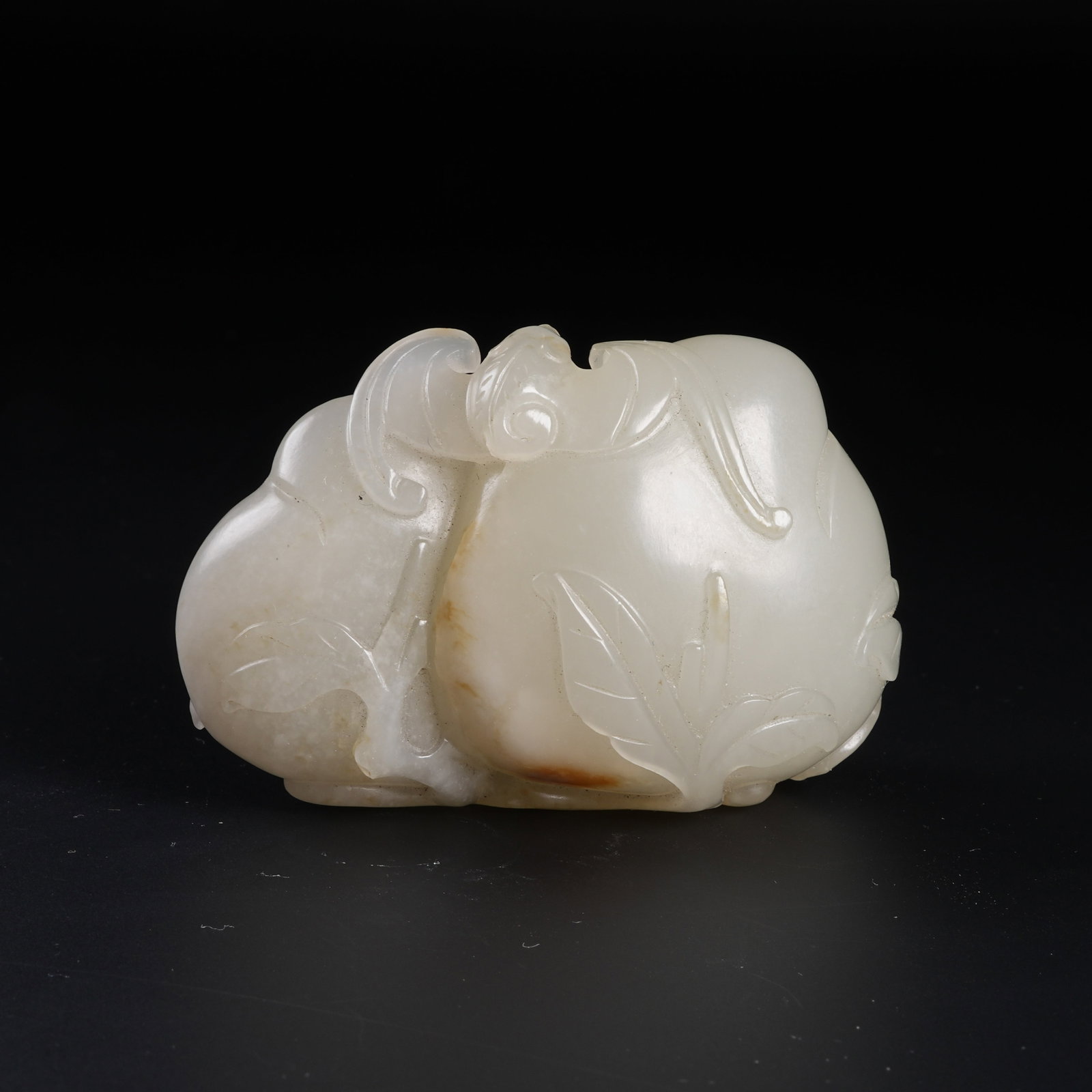A HETIAN JADE LONGEVITY PEACH ORNAMENT: Hetian Jade Longevity Peach Ornament