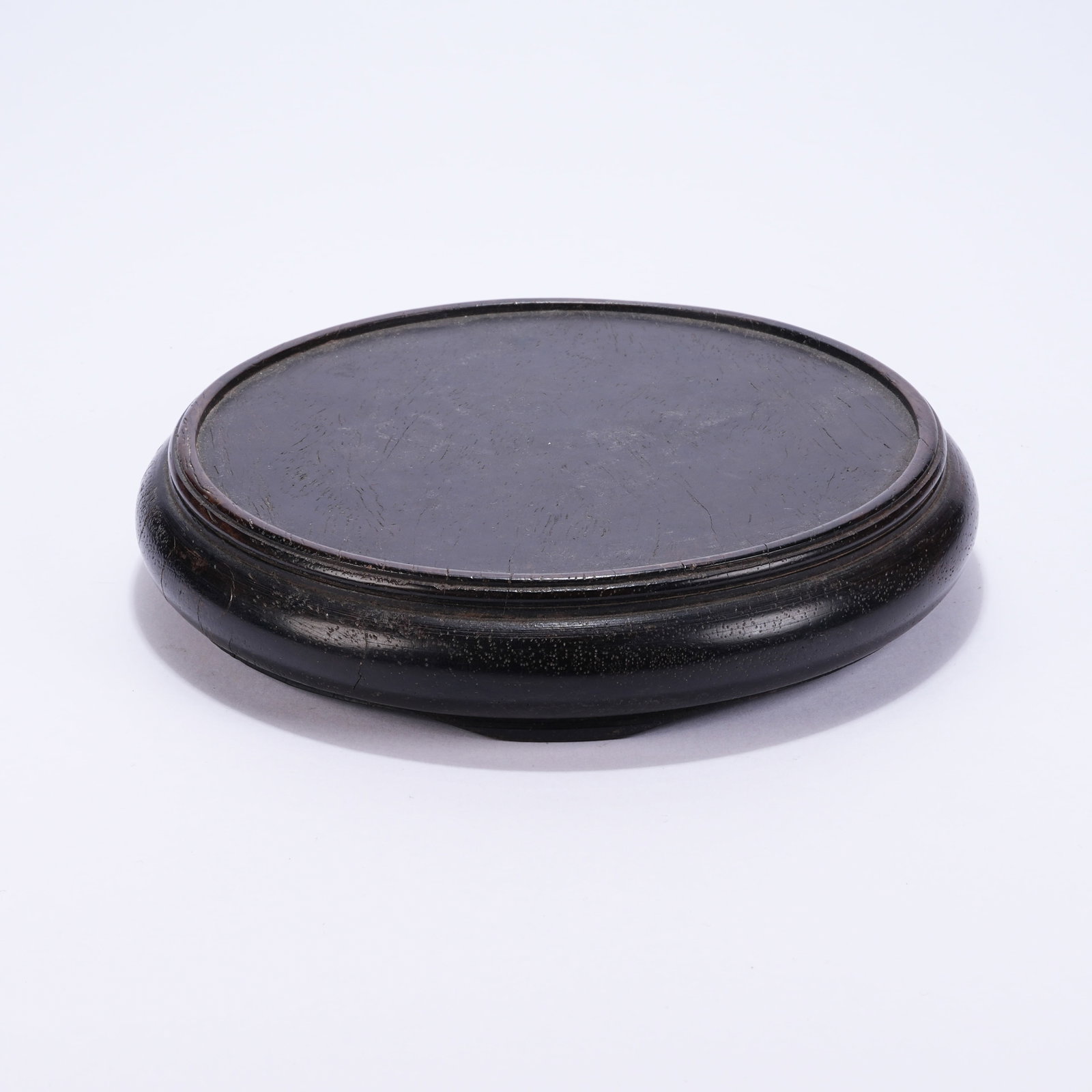 A ROUND RED SANDALWOOD STAND: Round Red Sandalwood Stand
