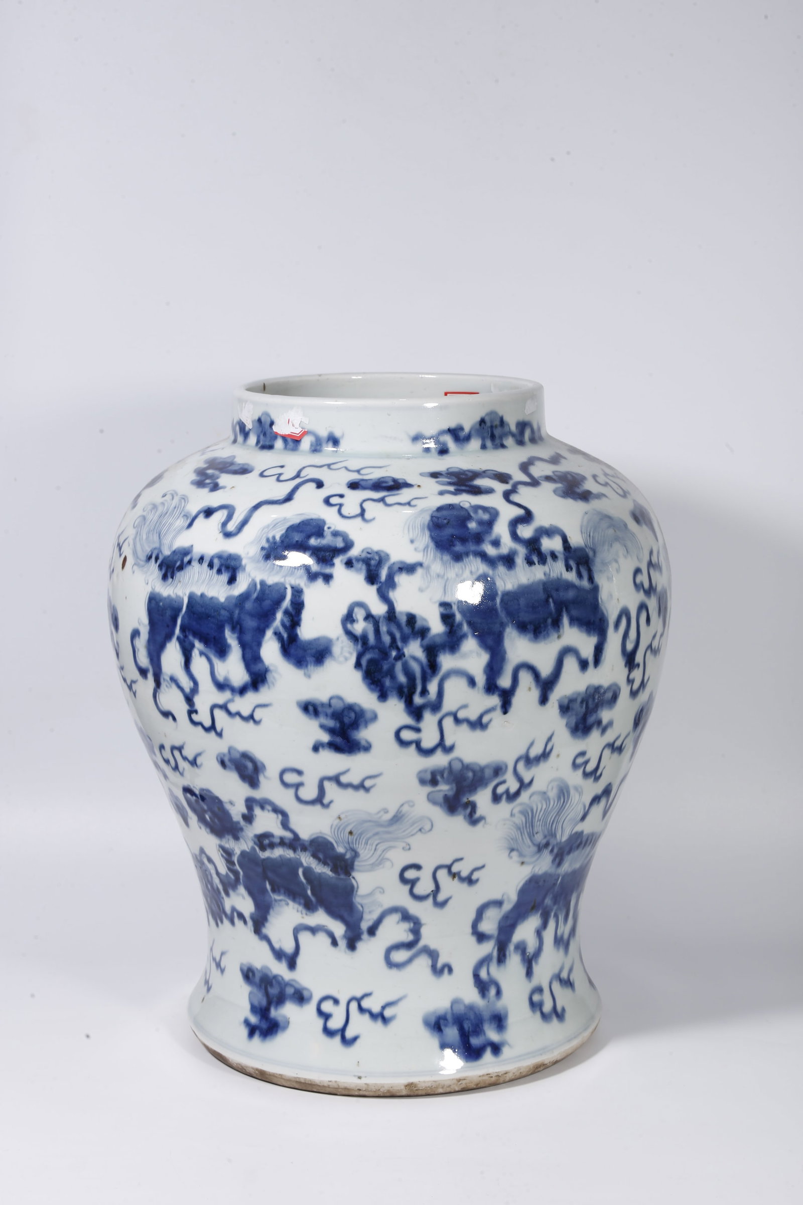 A BLUE AND WHITE JAR WITH LIONS PLAYING SILK BALL PATTERNS: Blue and White Jar with Lions Playing Silk Ball Patterns