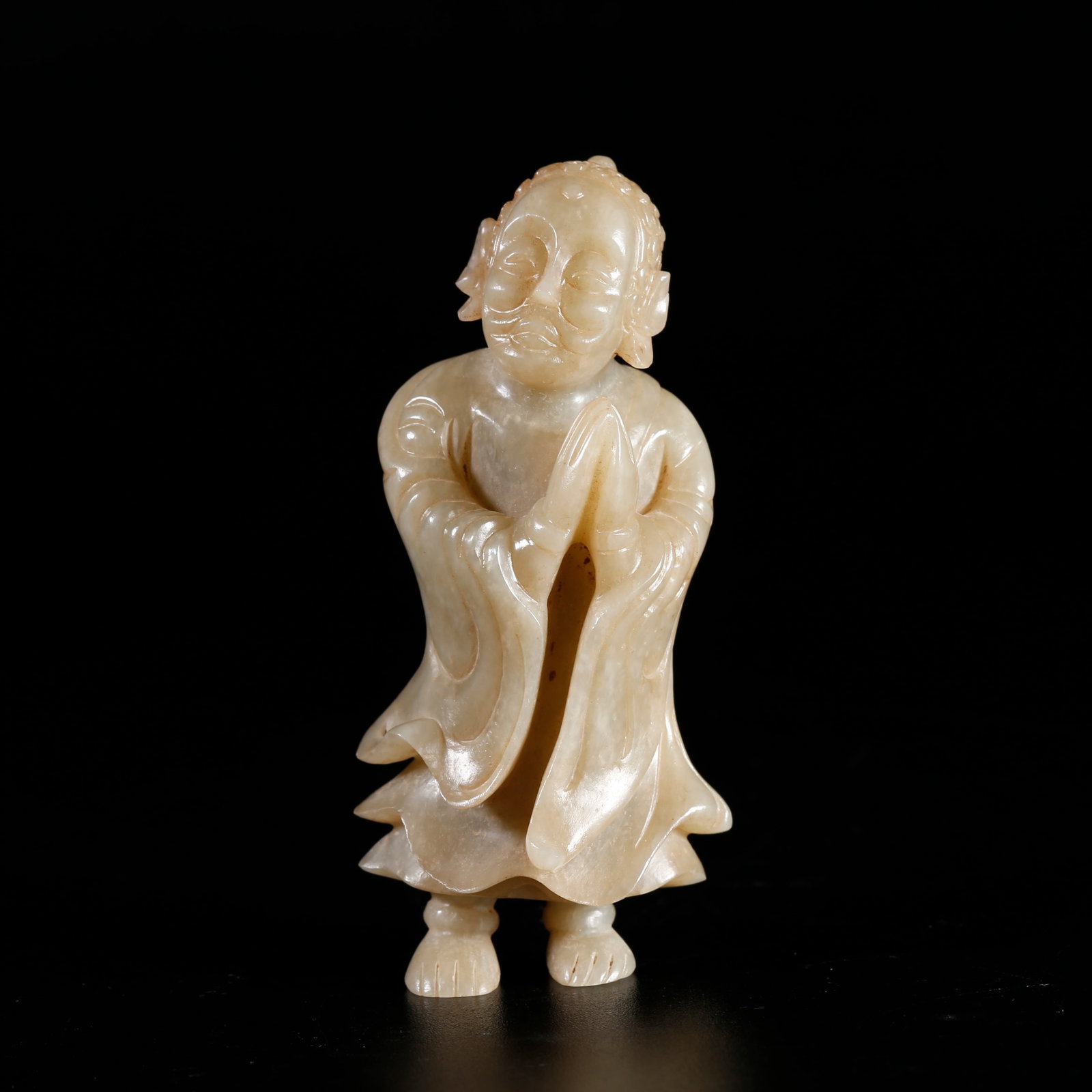 A HETIAN JADE ORNAMENT CARVED IN HUMAN FIGURE FORM: Hetian Jade Ornament Carved in Human Figure Form