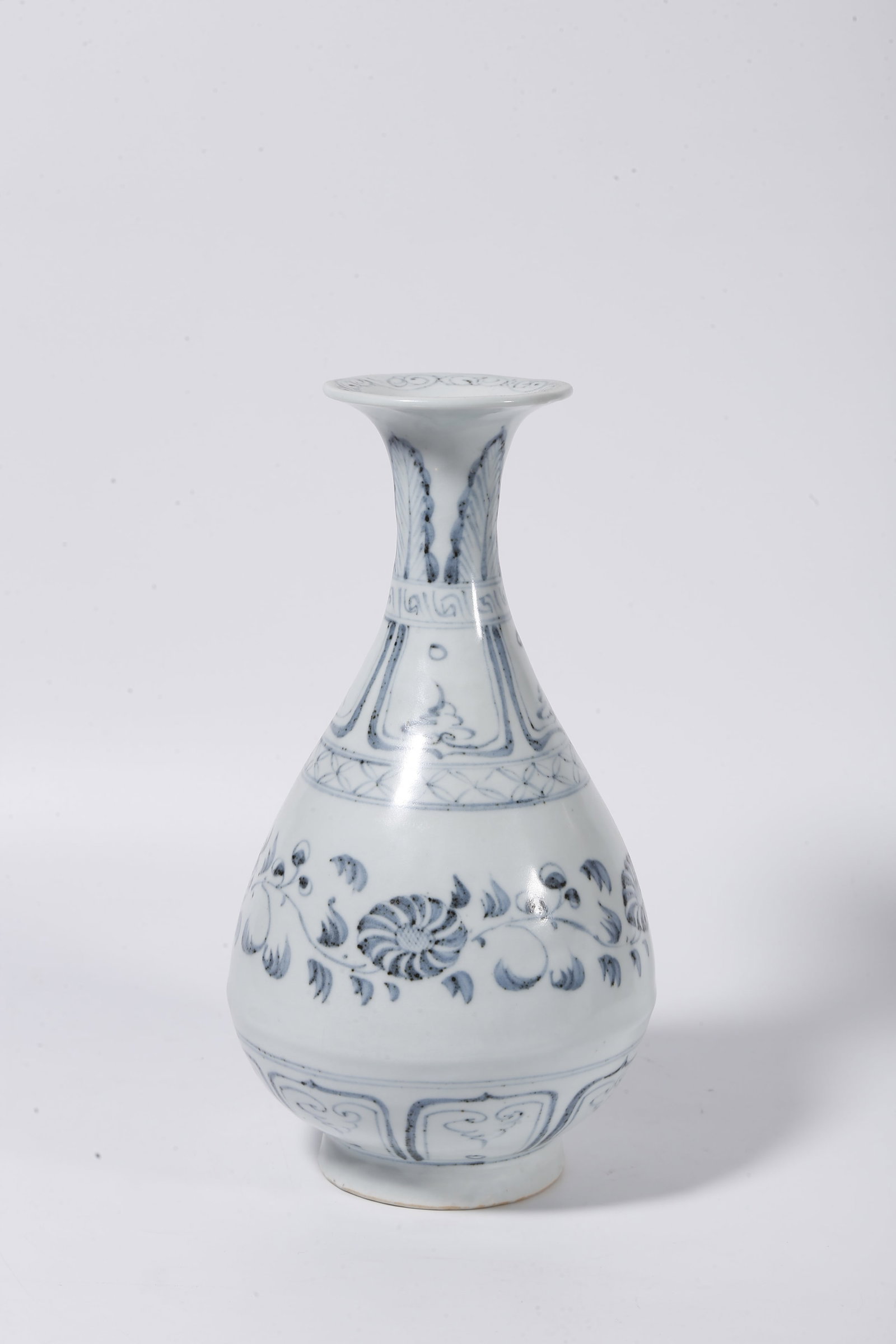A BLUE AND WHITE YUHUCHUN VASE WITH INTERLOCKING FLORAL PATTERNS: Blue and White Yuhuchun Vase with Interlocking Floral Patterns
