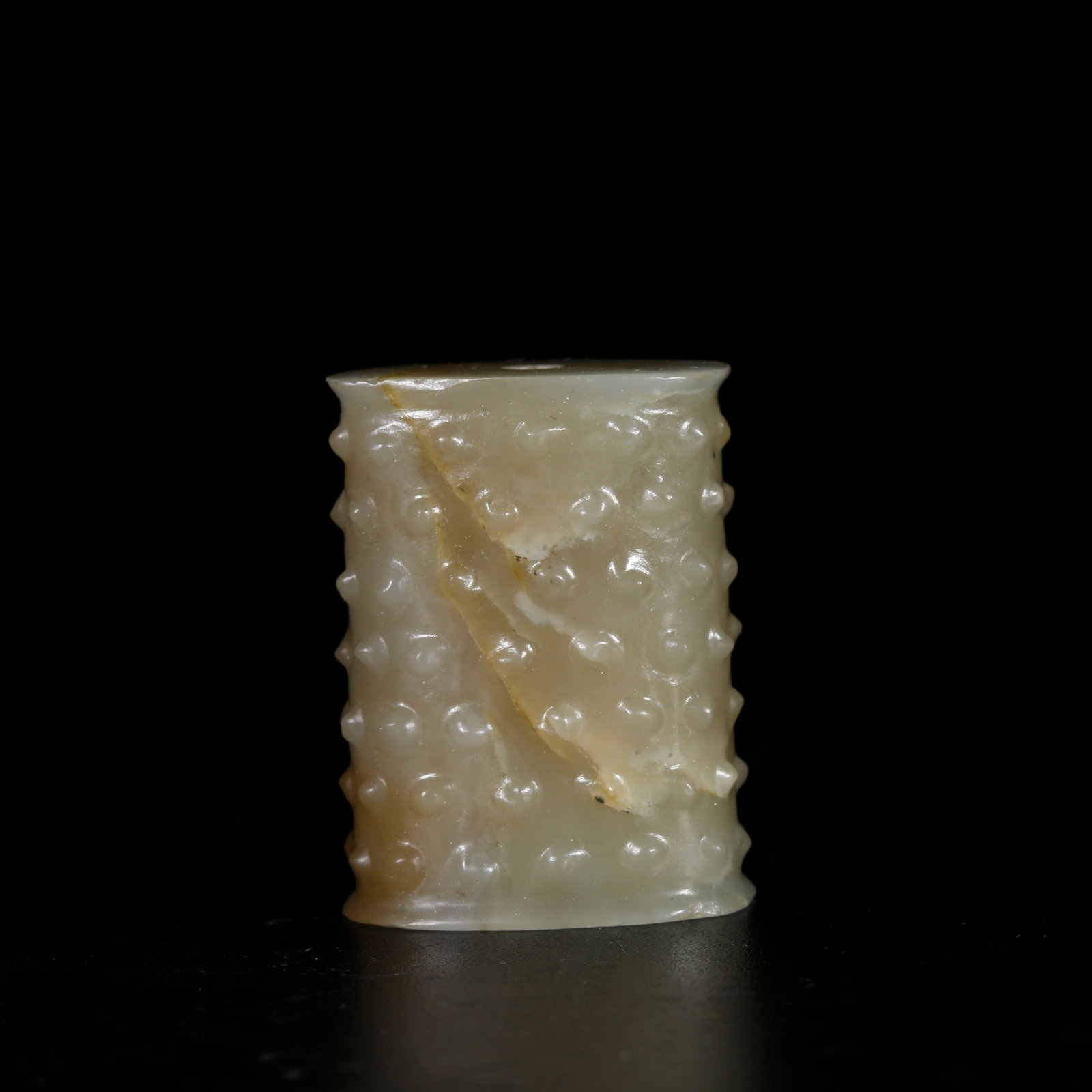 A ANCIENT JADE TUBE PENDANT WITH NAIL BOSS PATTERNS: Ancient Jade Tube Pendant with Nail Boss Patterns