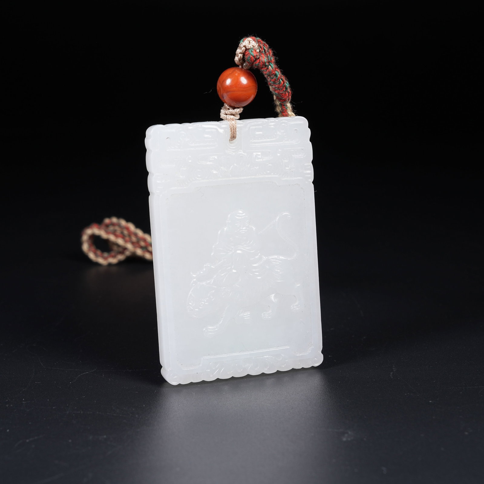 A WHITE HETIAN JADE PLAQUE OF ARHAT SUBDUING TIGER (1 of 8)