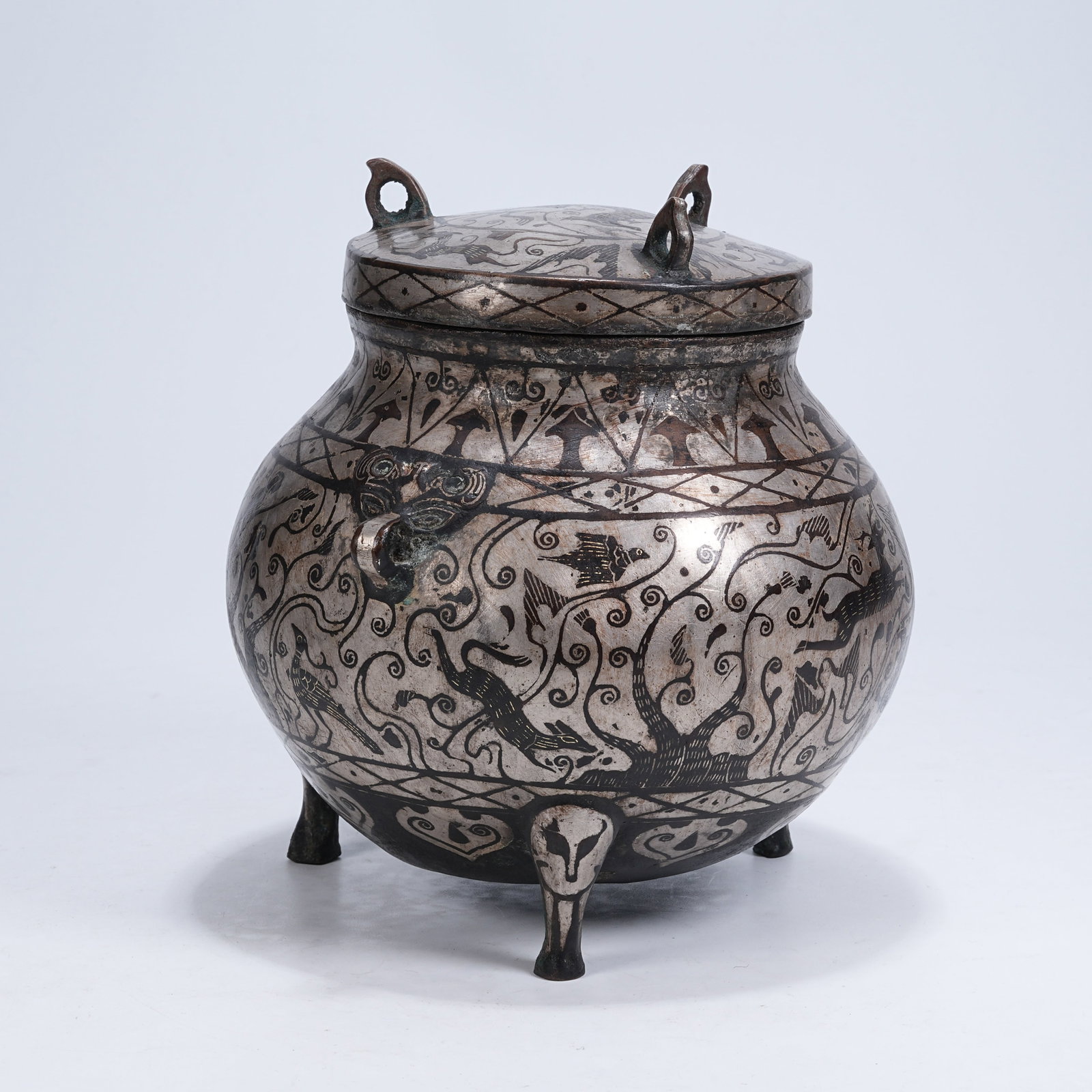 A THREE-LEGGED COVERED BRONZE CENSER INLAID WITH SILVER DECORATED WITH AUSPICIOUS BEAST PATTERNS (1 of 10)