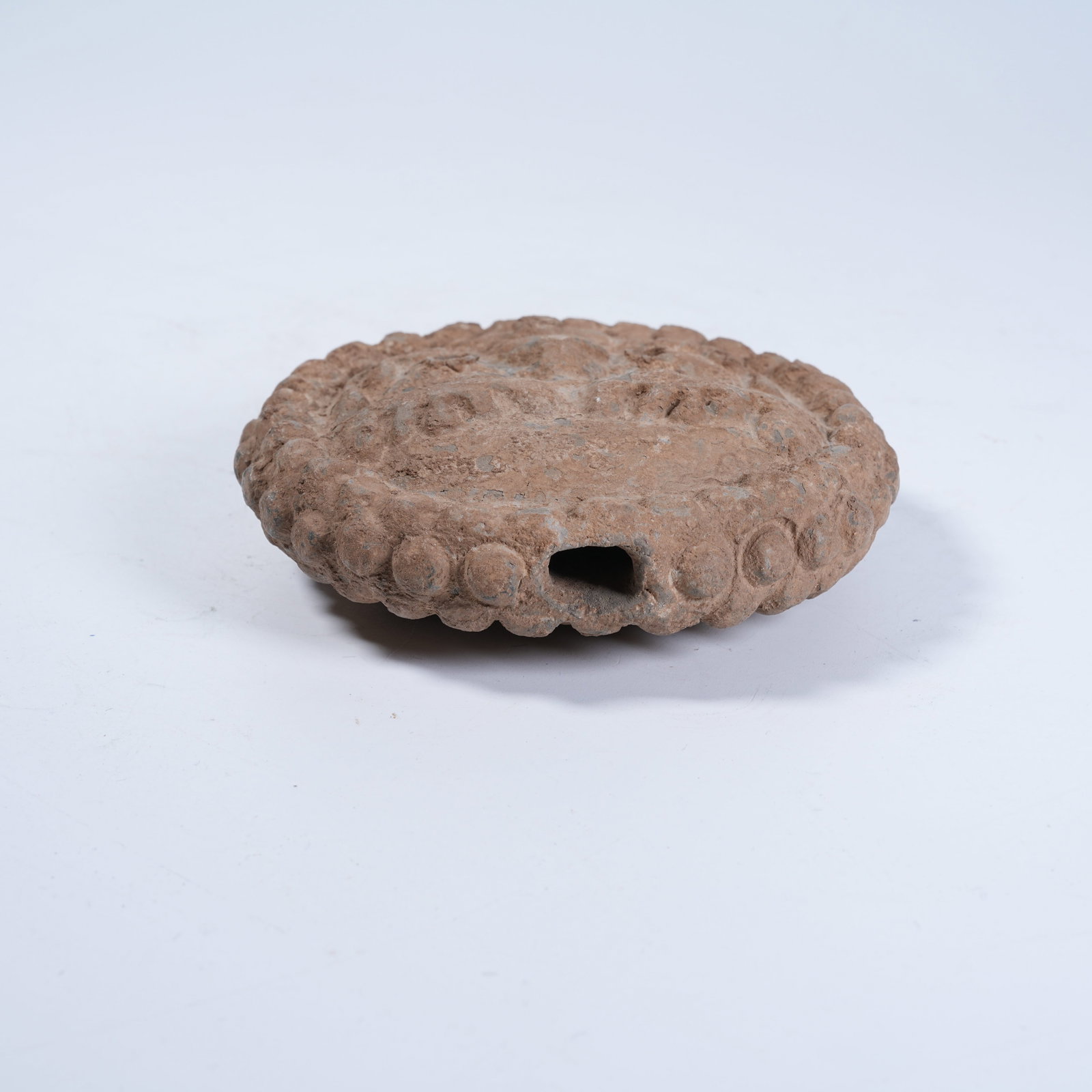 A POTTERY EAVES TILE WITH HUMAN FACE PATTERN - 7