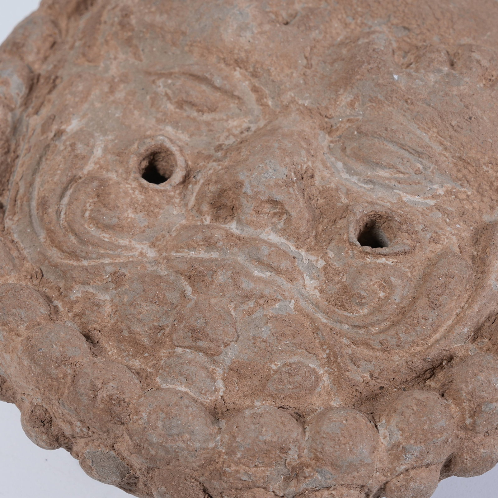 A POTTERY EAVES TILE WITH HUMAN FACE PATTERN - 9