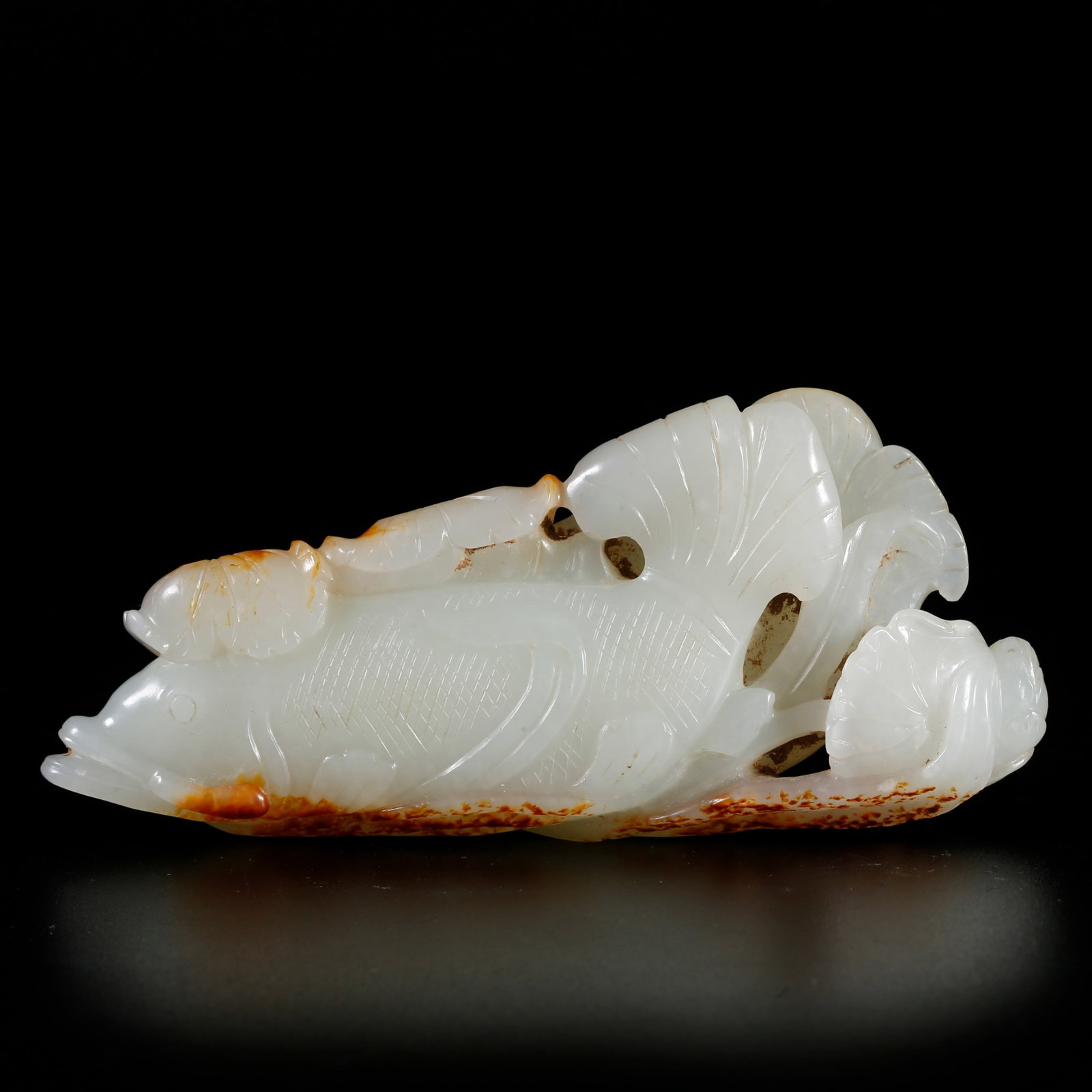 A HETIAN JADE ORNAMENT OF LOTUS AND FISH (SYMBOLIZING SURPLUS YEAR AFTER YEAR): Hetian Jade Ornament of Lotus and Fish (Symbolizing Surplus Year after Year)