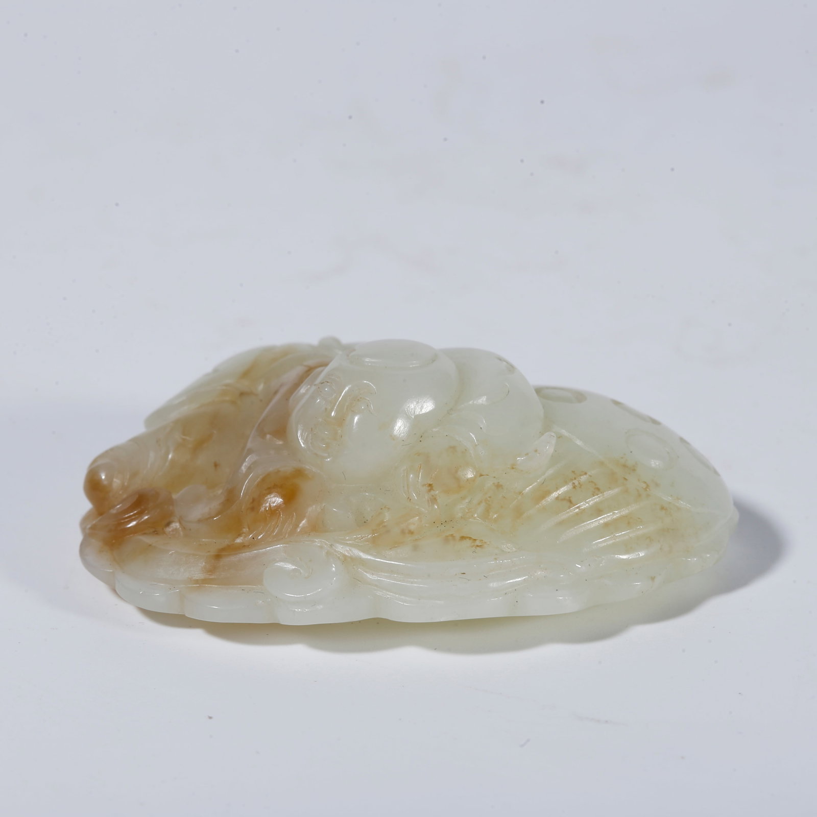 A HETIAN JADE ORNAMENT CARVED WITH FIGURE PATTERNS (1 of 9)
