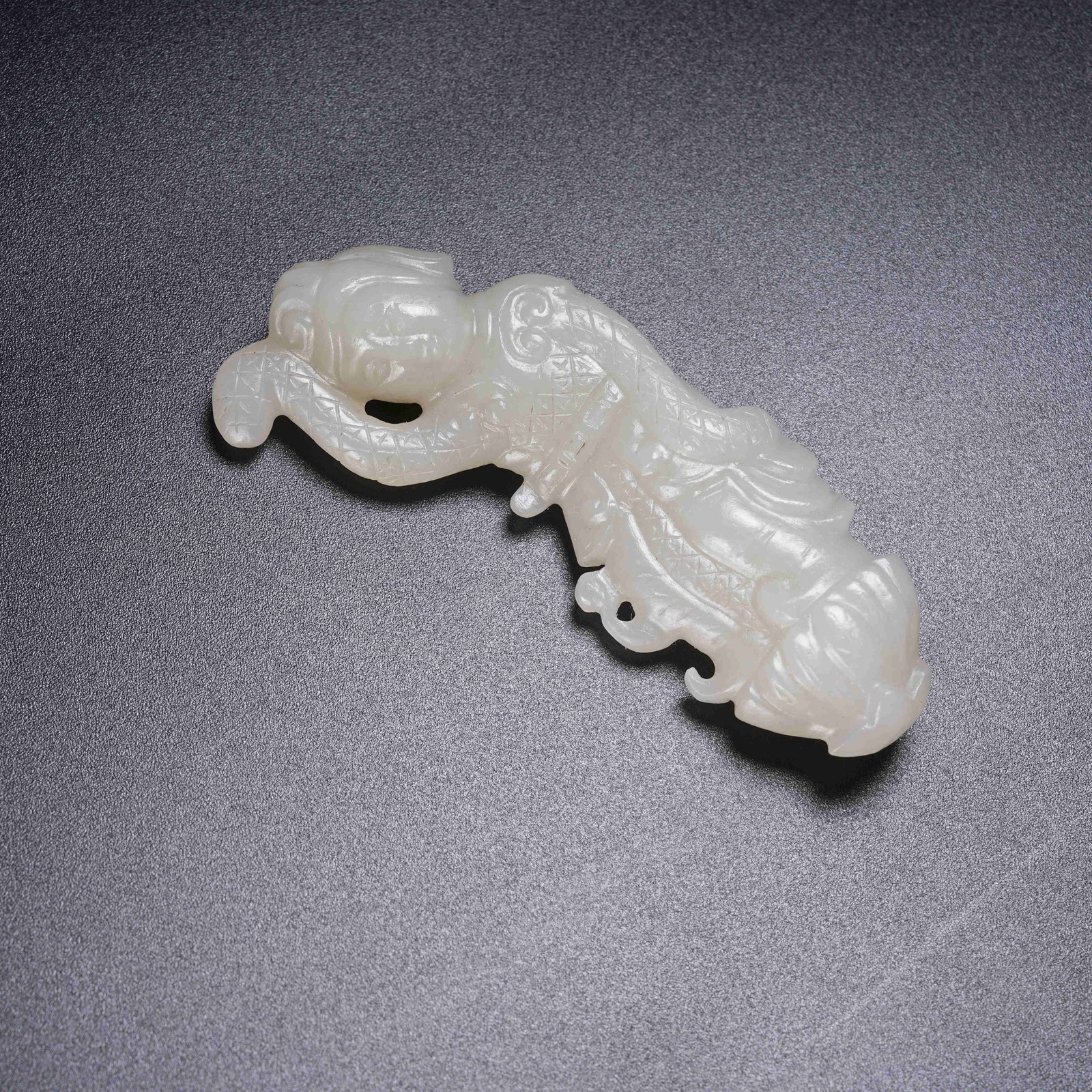 A HETIAN JADE DANCING FIGURE (1 of 9)