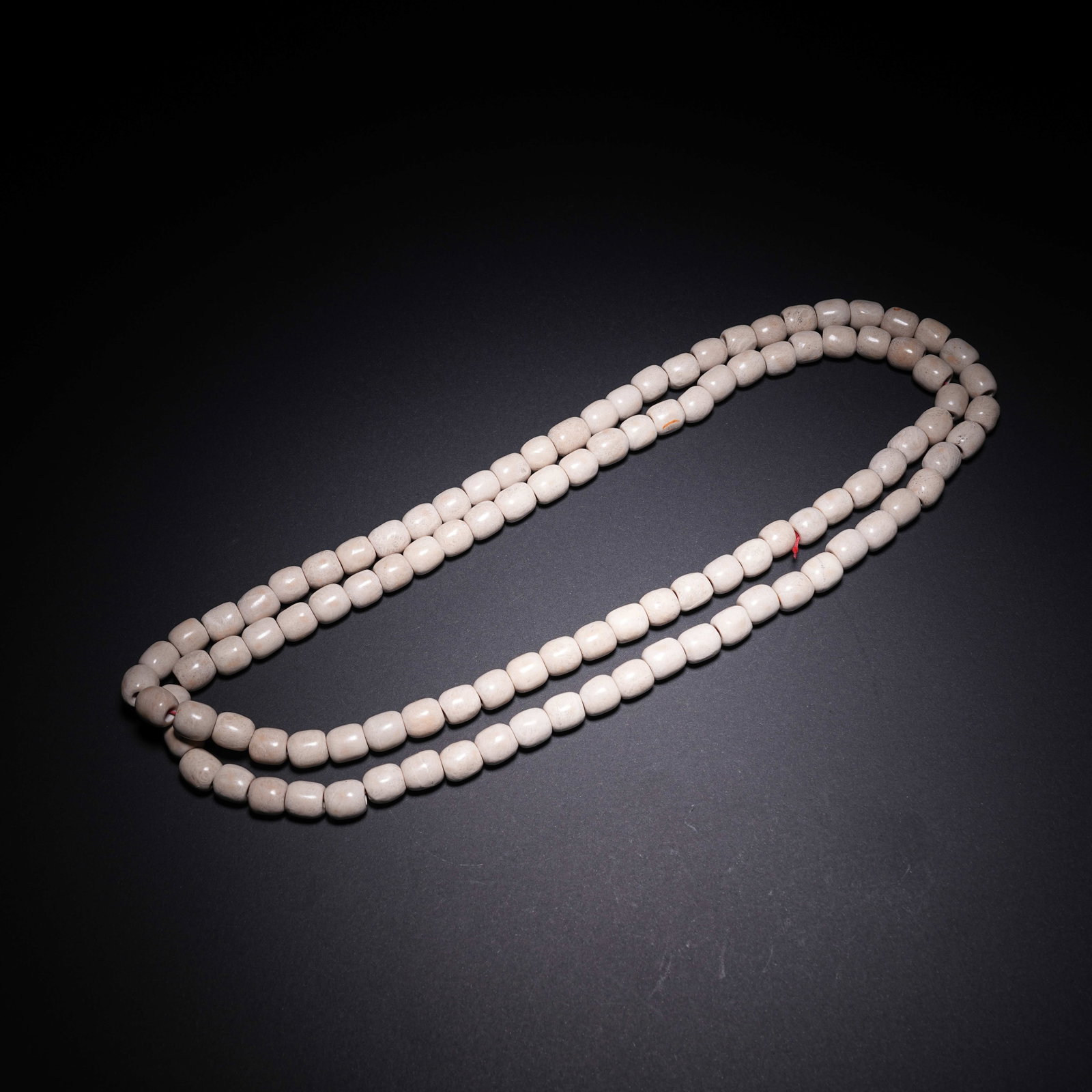 A CHICKEN-BONE WHITE JADE NECKLACE OF LIANGZHU CULTURE: Chicken-bone White Jade Necklace of Liangzhu Culture
