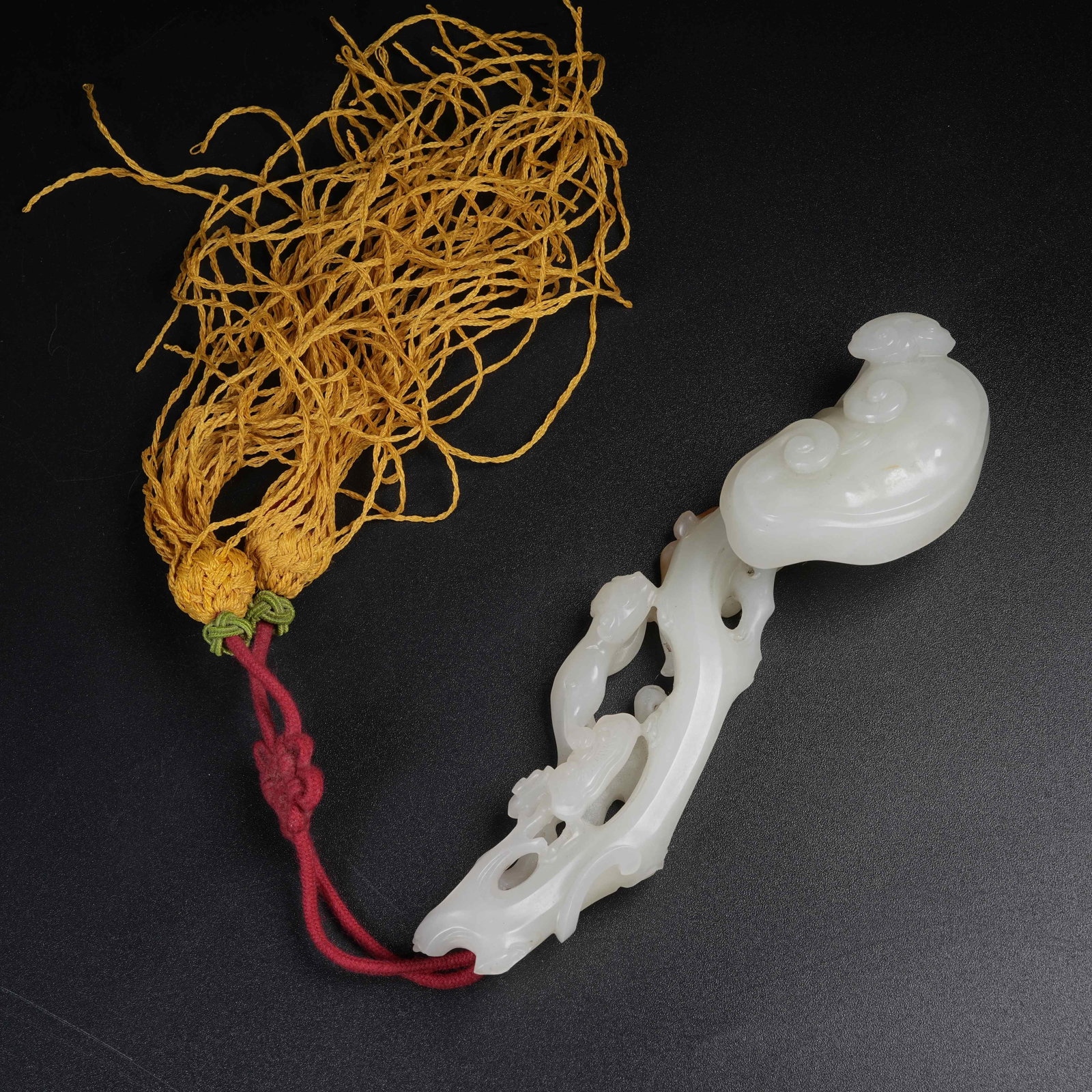 A WHITE HETIAN JADE GANODERMA RUYI: White Hetian Jade Ganoderma Ruyi