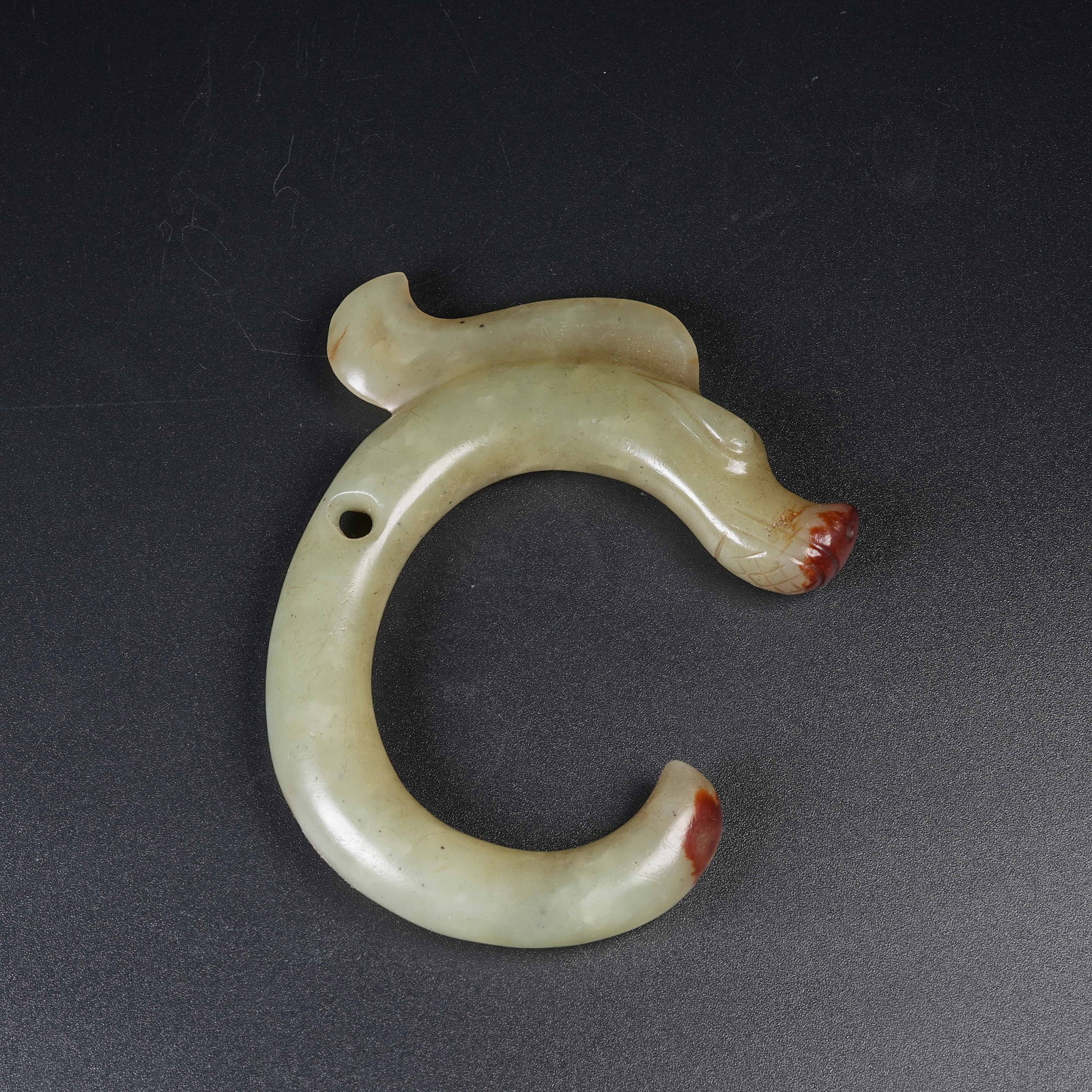 A ANCIENT JADE C-SHAPED DRAGON PENDANT: Ancient Jade C-shaped Dragon Pendant