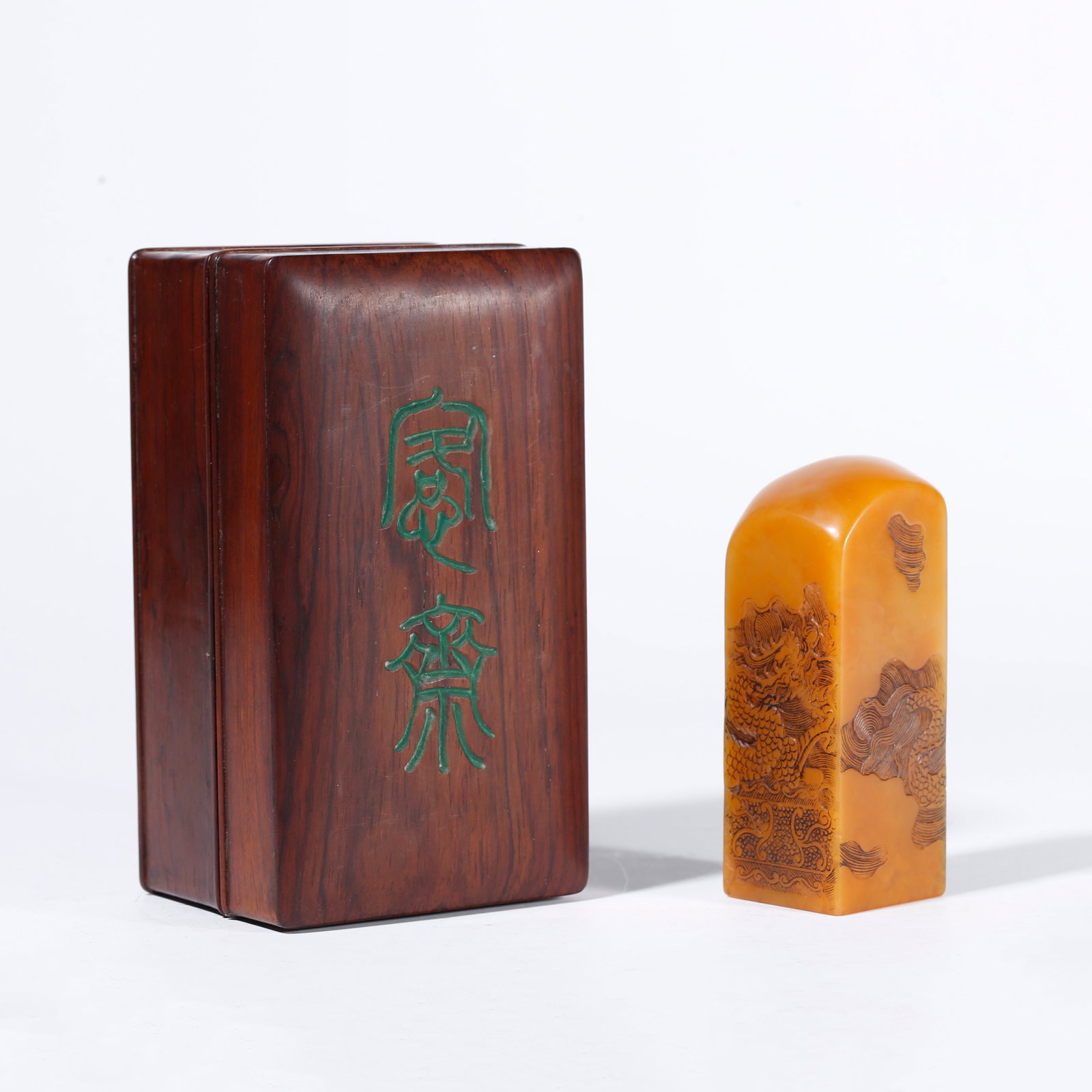 A SHOUSHAN STONE SEAL WITH WAVE AND DRAGON PATTERN: Shoushan Stone Seal with Wave and Dragon Pattern
