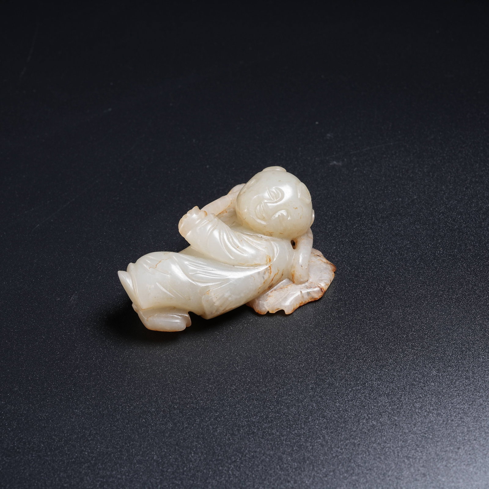 A HETIAN JADE BOY HOLDING LOTUS: Hetian Jade Boy Holding Lotus