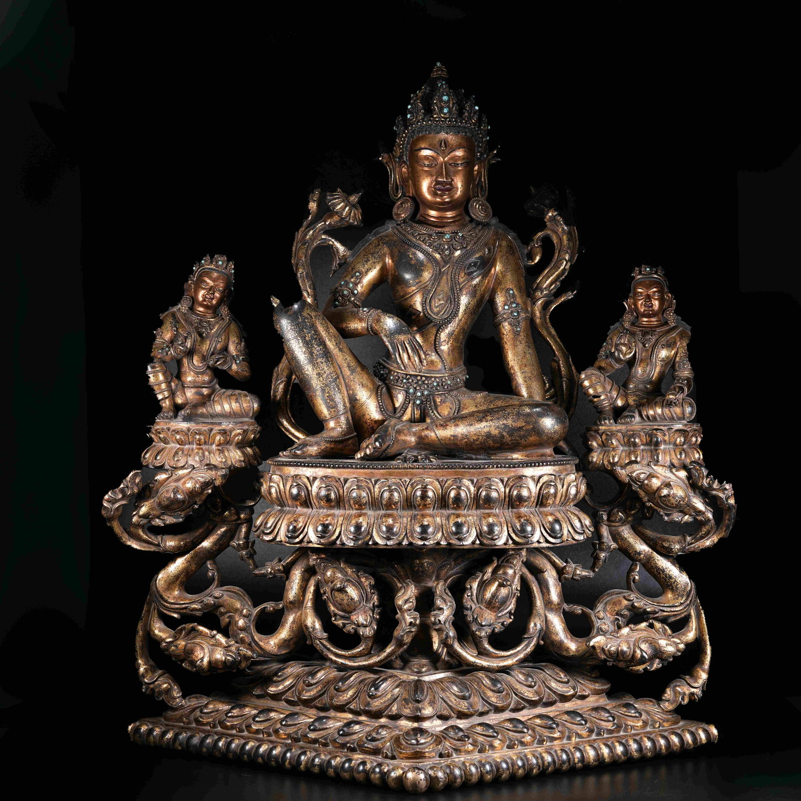 A GILT BRONZE STATUE OF FREE AND EASY GUANYIN: Gilt Bronze Statue of Free and Easy Guanyin