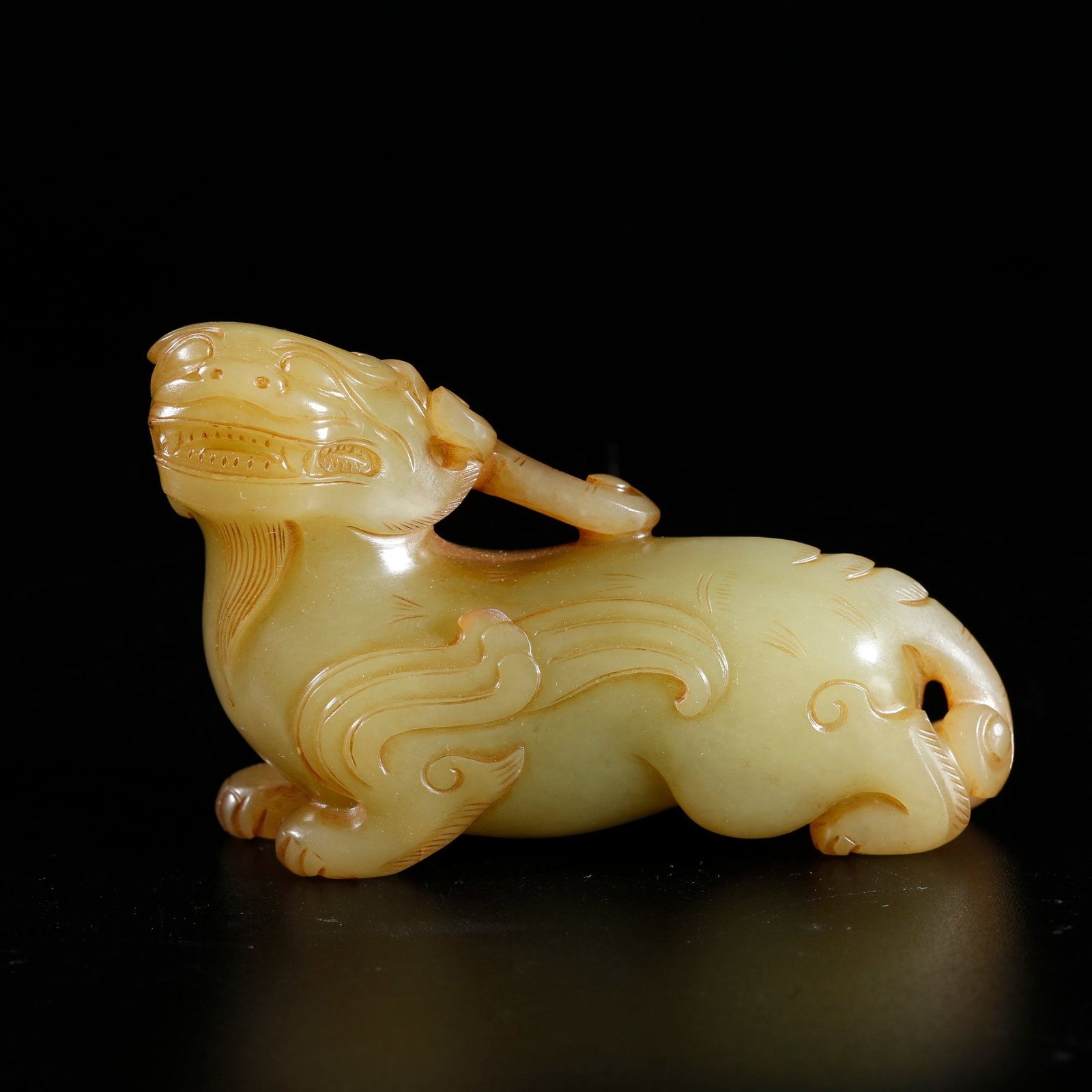 A HETIAN JADE ORNAMENT IN AUSPICIOUS BEAST SHAPE: Hetian Jade Ornament in Auspicious Beast Shape