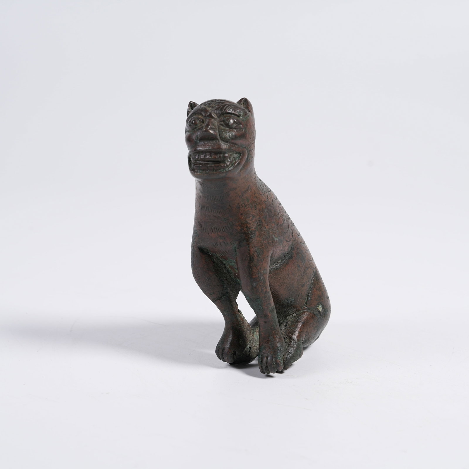 A BRONZE ORNAMENT OF AUSPICIOUS BEAST: Bronze Ornament of Auspicious Beast