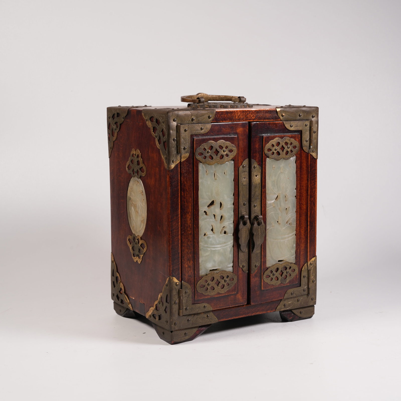 A HUANGHUALI WOOD LIFTING-HANDLE TREASURE CHEST INLAID WITH HETIAN JADE FLOWER PATTERN: Huanghuali Wood Lifting-Handle Treasure Chest Inlaid with Hetian Jade Flower Pattern