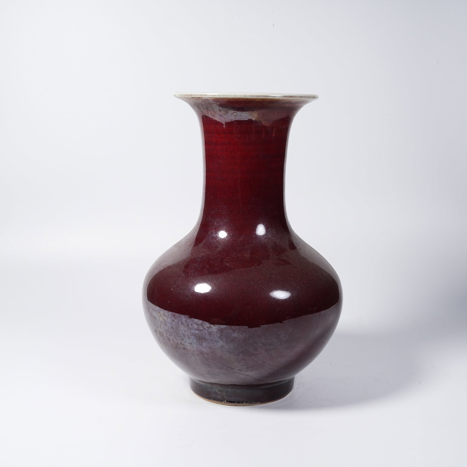 A SACRIFICIAL RED GLAZED PLATE-MOUTHED VASE: Sacrificial Red Glazed Plate-mouthed Vase