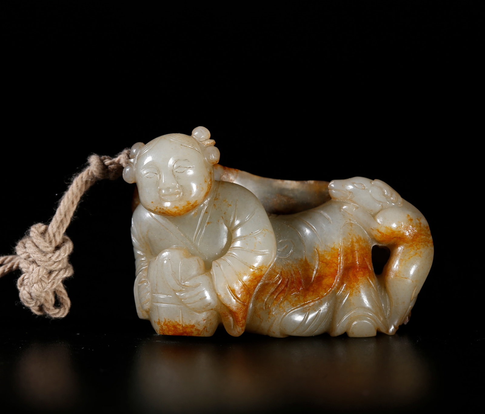 A HETIAN JADE ORNAMENT CARVED AS BOY FIGURE (1 of 9)