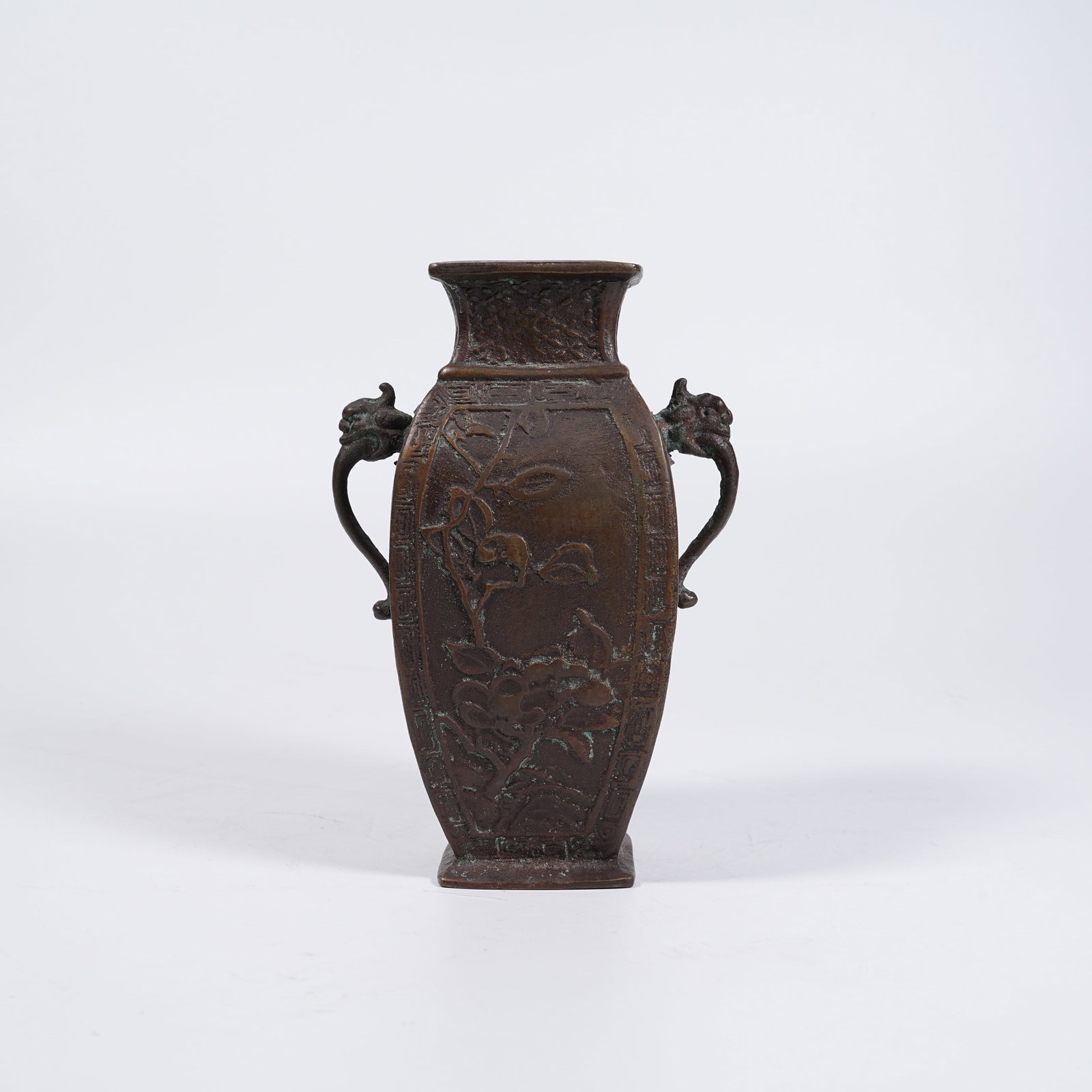 A BRONZE VASE WITH DRAGON EARS AND AUSPICIOUS PEACH PATTERNS: Bronze Vase with Dragon Ears and Auspicious Peach Patterns