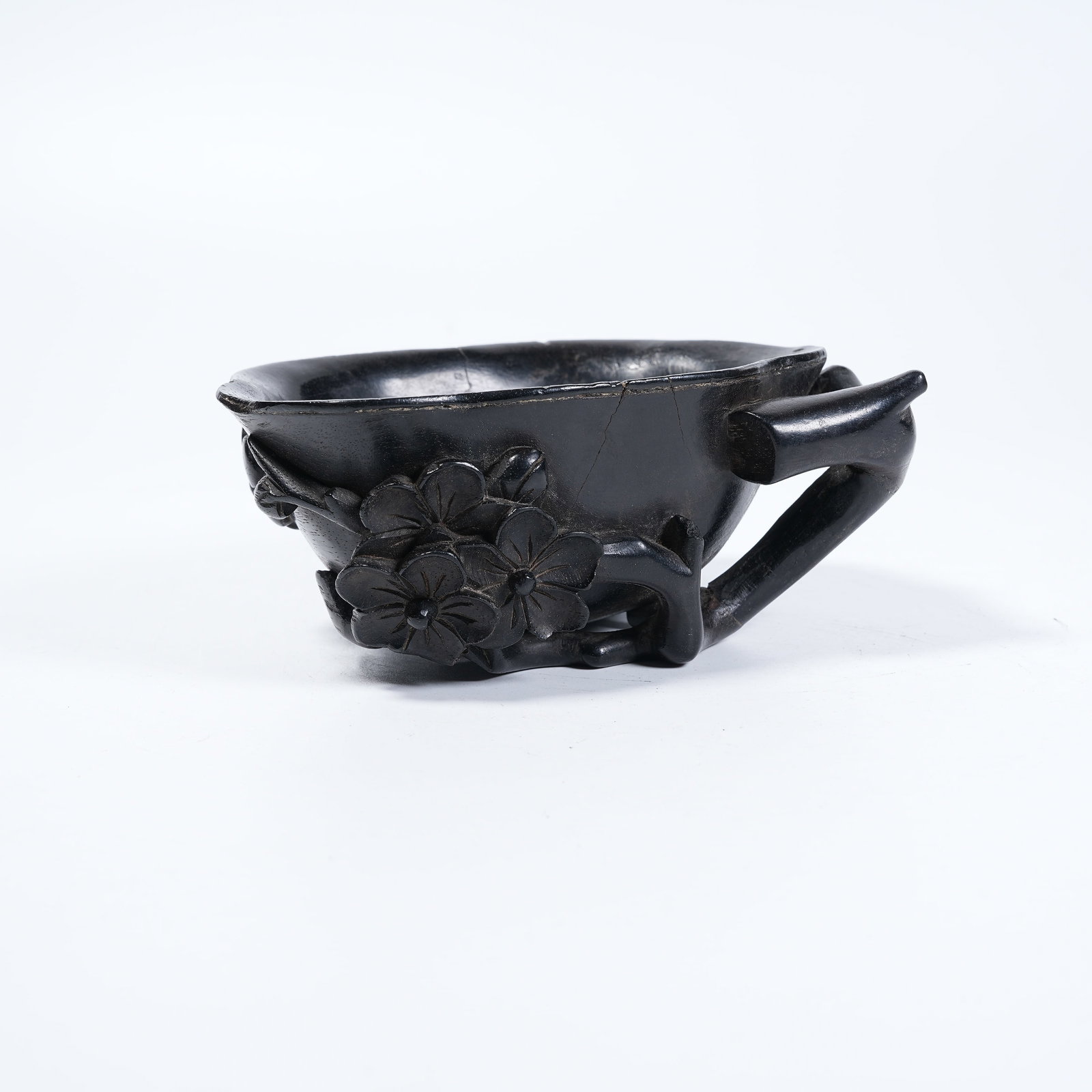 A RED SANDALWOOD BRUSH REST CARVED WITH FLORAL PATTERNS: Red Sandalwood Brush Rest Carved with Floral Patterns