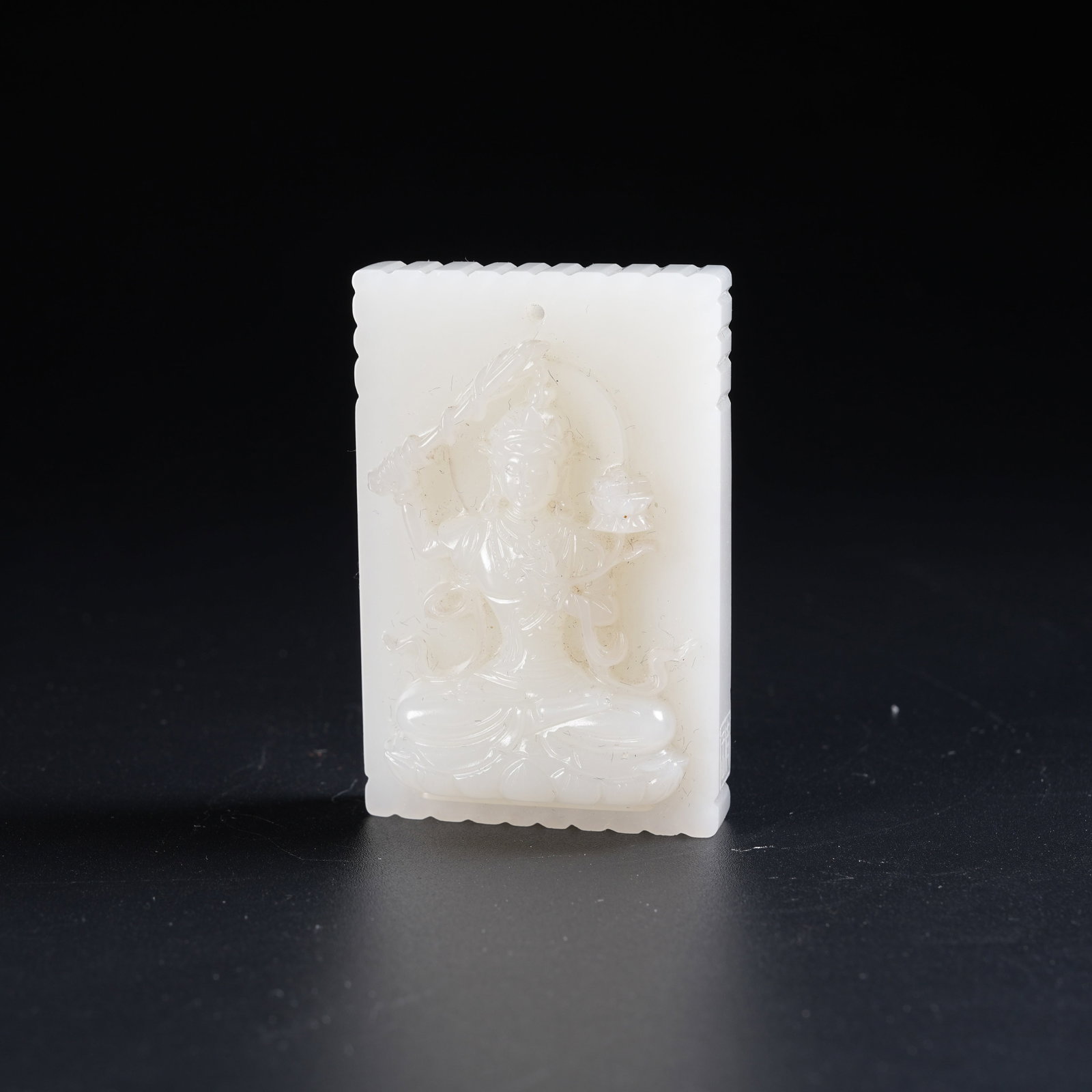 A WHITE HETIAN JADE PLAQUE OF BODHISATTVA: White Hetian Jade Plaque of Bodhisattva