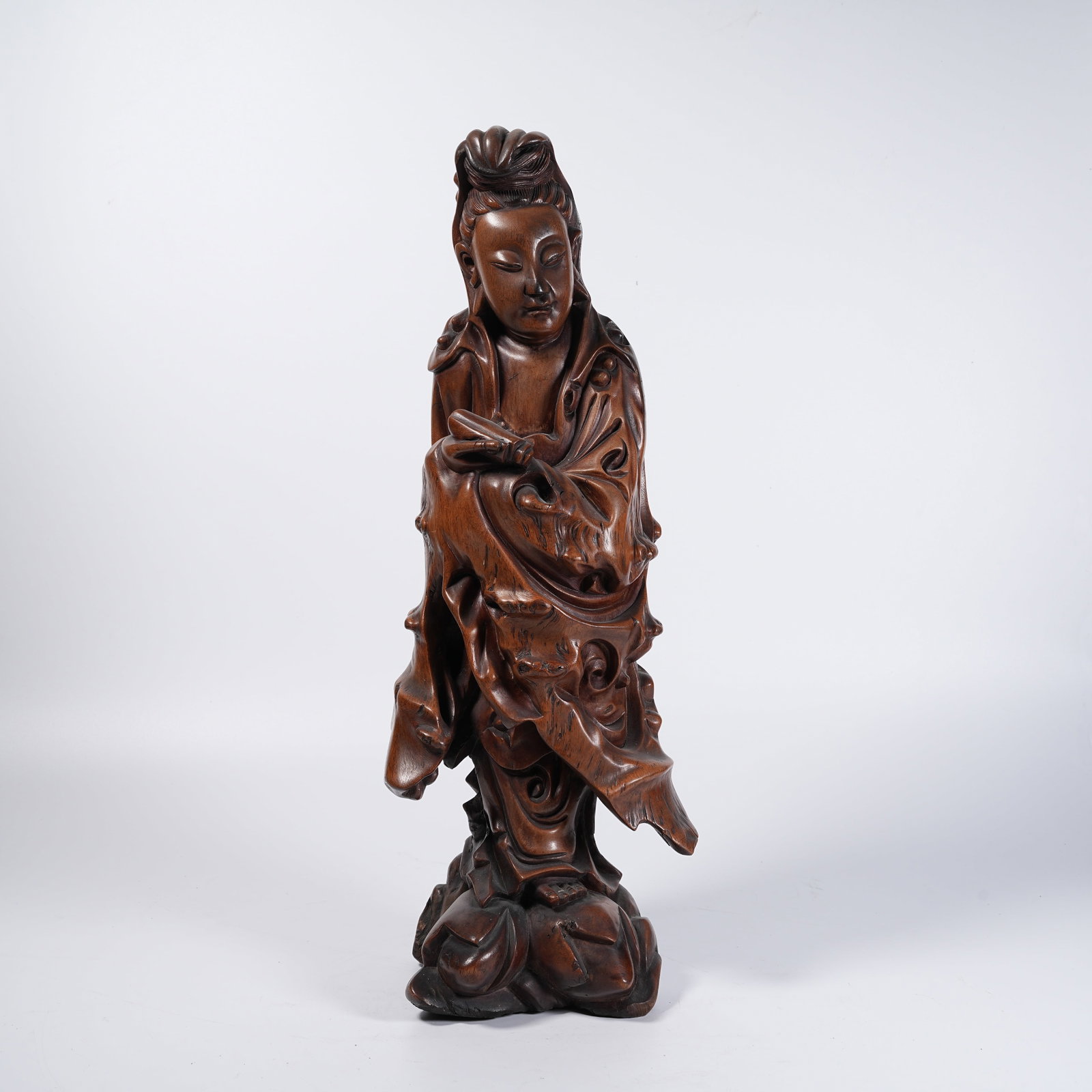 A STANDING GUANYIN STATUE OF HUANGHUALI WOOD: Standing Guanyin Statue of Huanghuali Wood