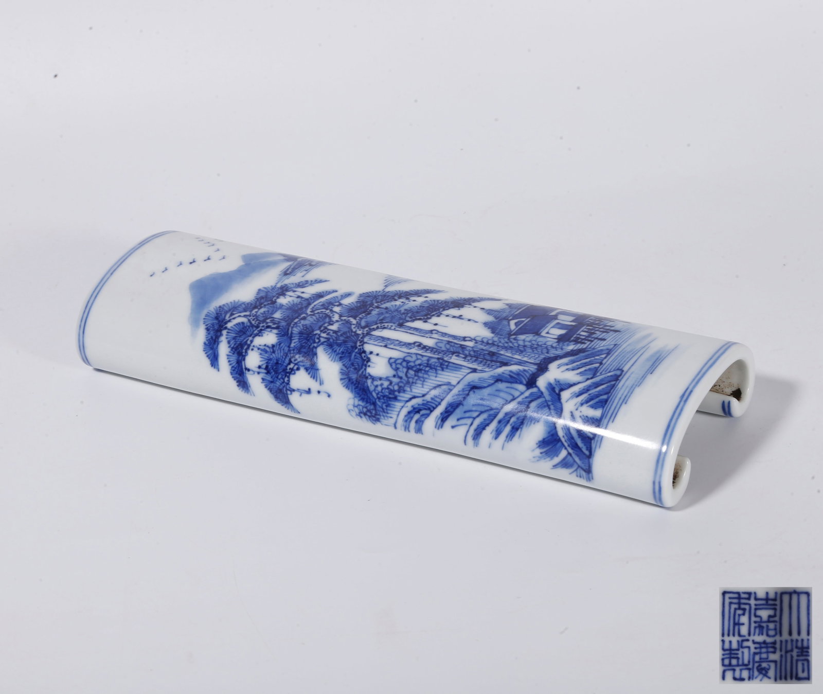 A BLUE AND WHITE ARM REST WITH LANDSCAPE PATTERNS (1 of 10)