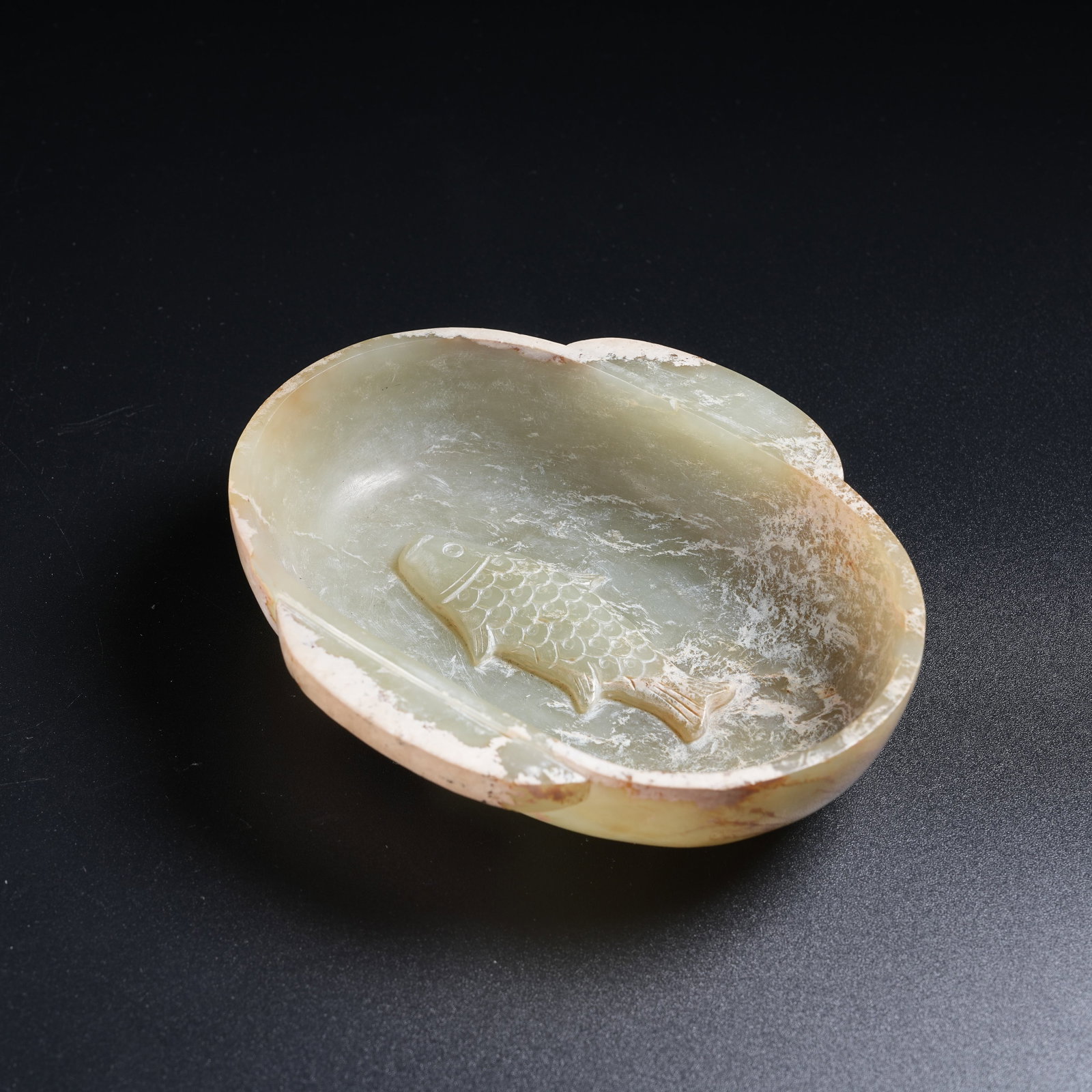 A ANCIENT JADE WASHER WITH FISH PATTERN: Ancient Jade Washer with Fish Pattern