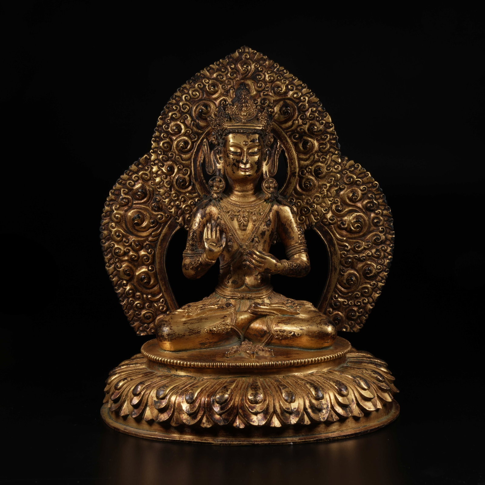 A GILT-BRONZE SEATED AVALOKITESHVARA STATUE: Gilt-Bronze Seated Avalokiteshvara Statue