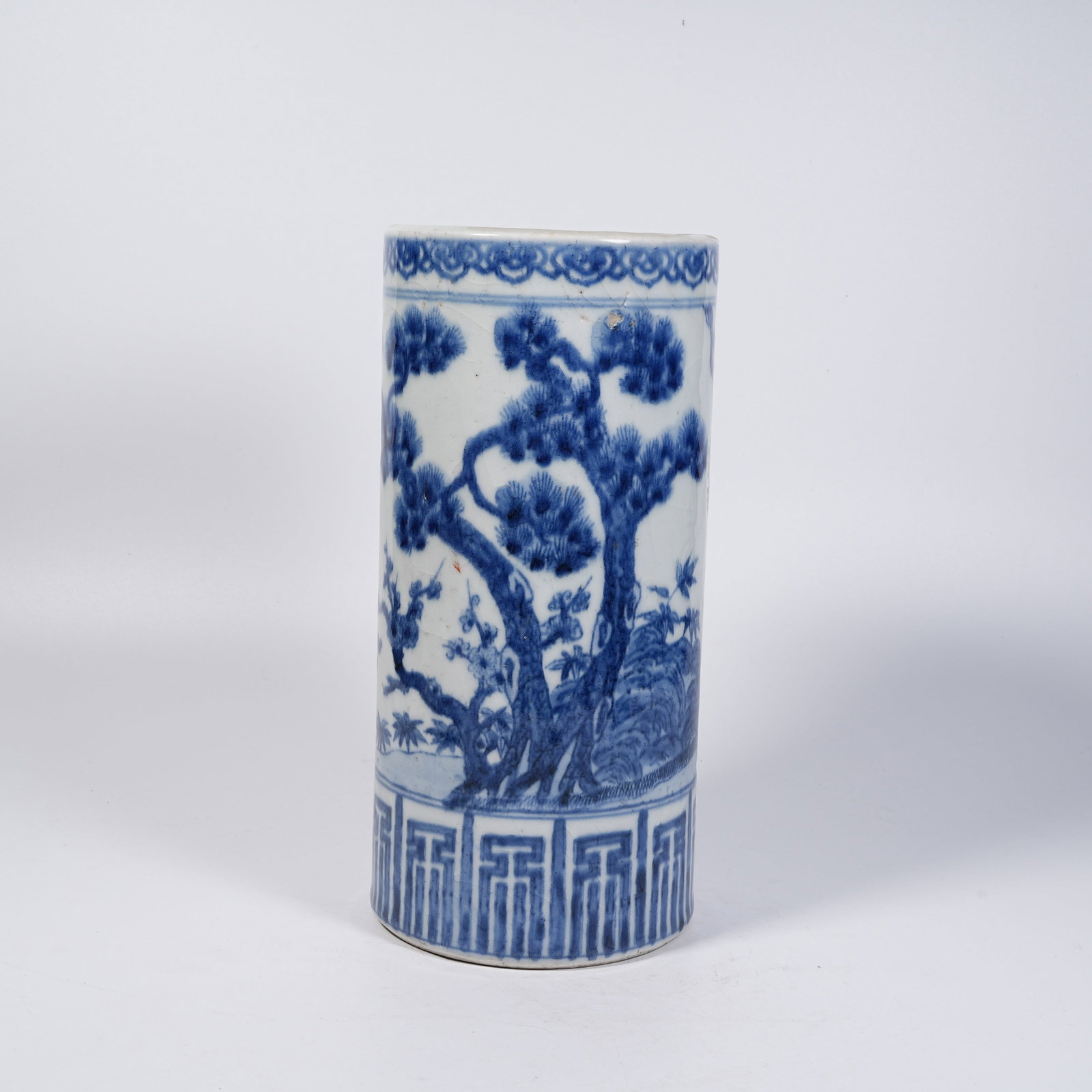 A BLUE AND WHITE HAT TUBE WITH PINE TREE PATTERNS: Blue and White Hat Tube with Pine Tree Patterns