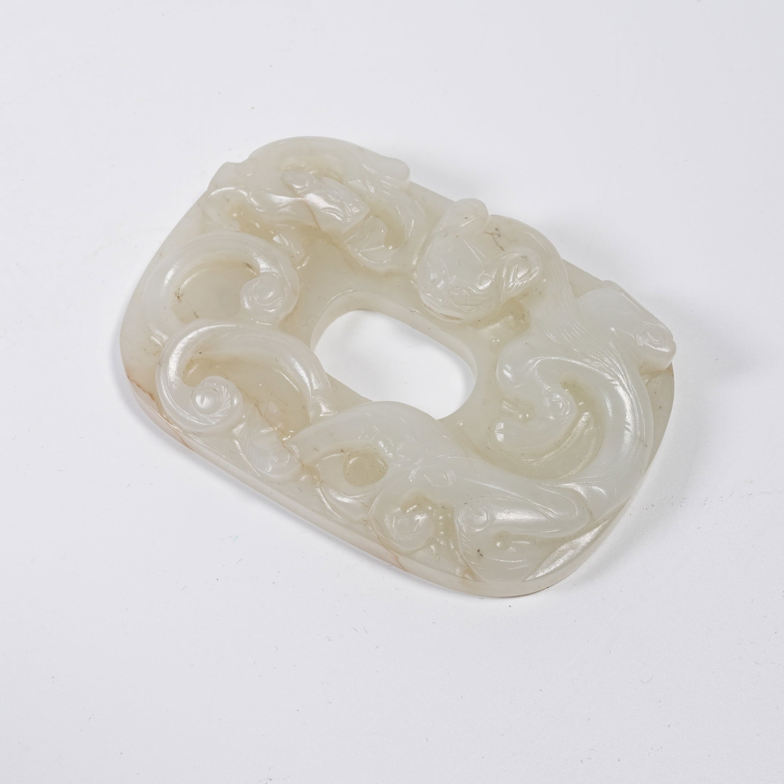 A HETIAN JADE PENDANT CARVED WITH CHI DRAGON PATTERNS: Hetian Jade Pendant Carved with Chi Dragon Patterns
