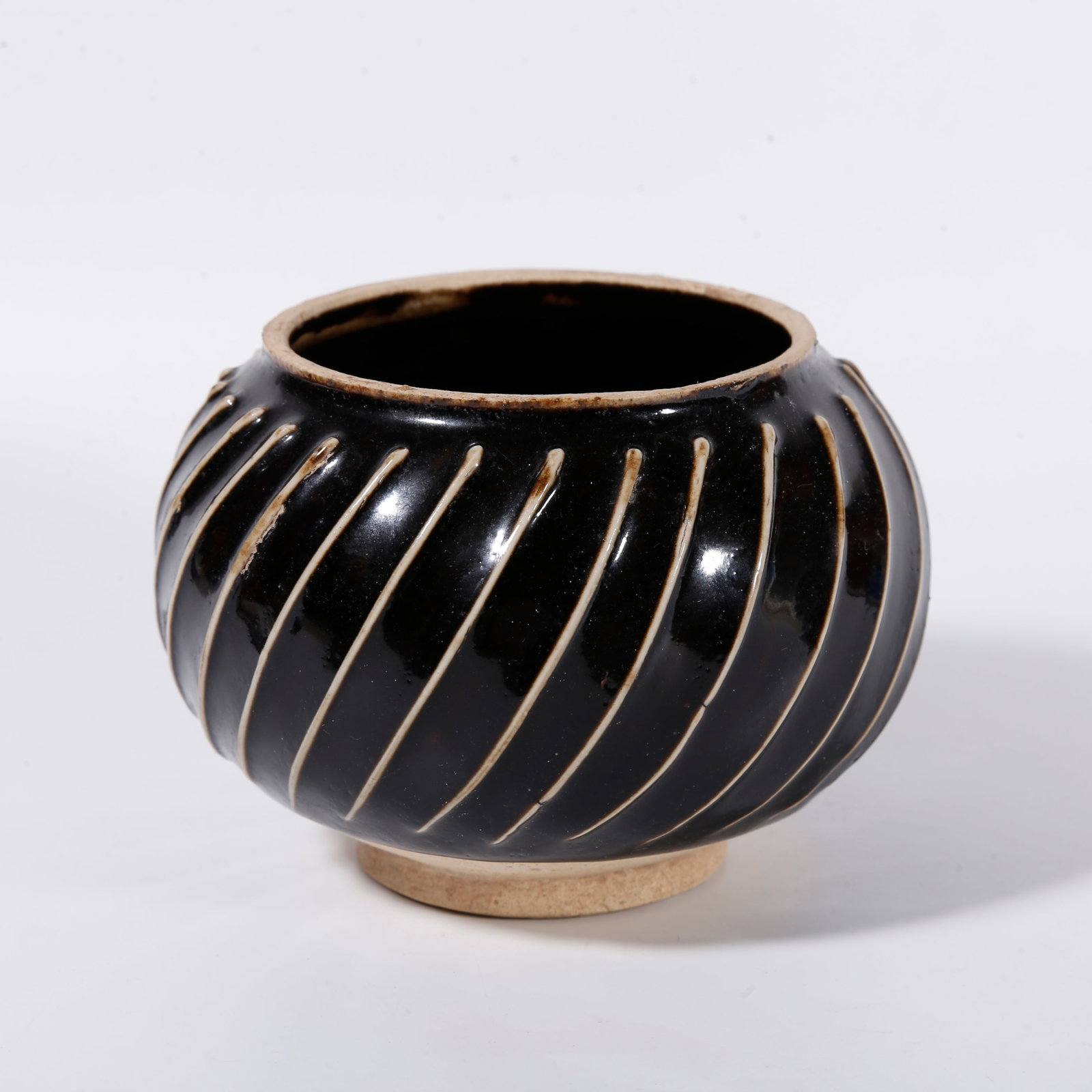 A DING KILN JAR WITH STRING PATTERNS (1 of 9)