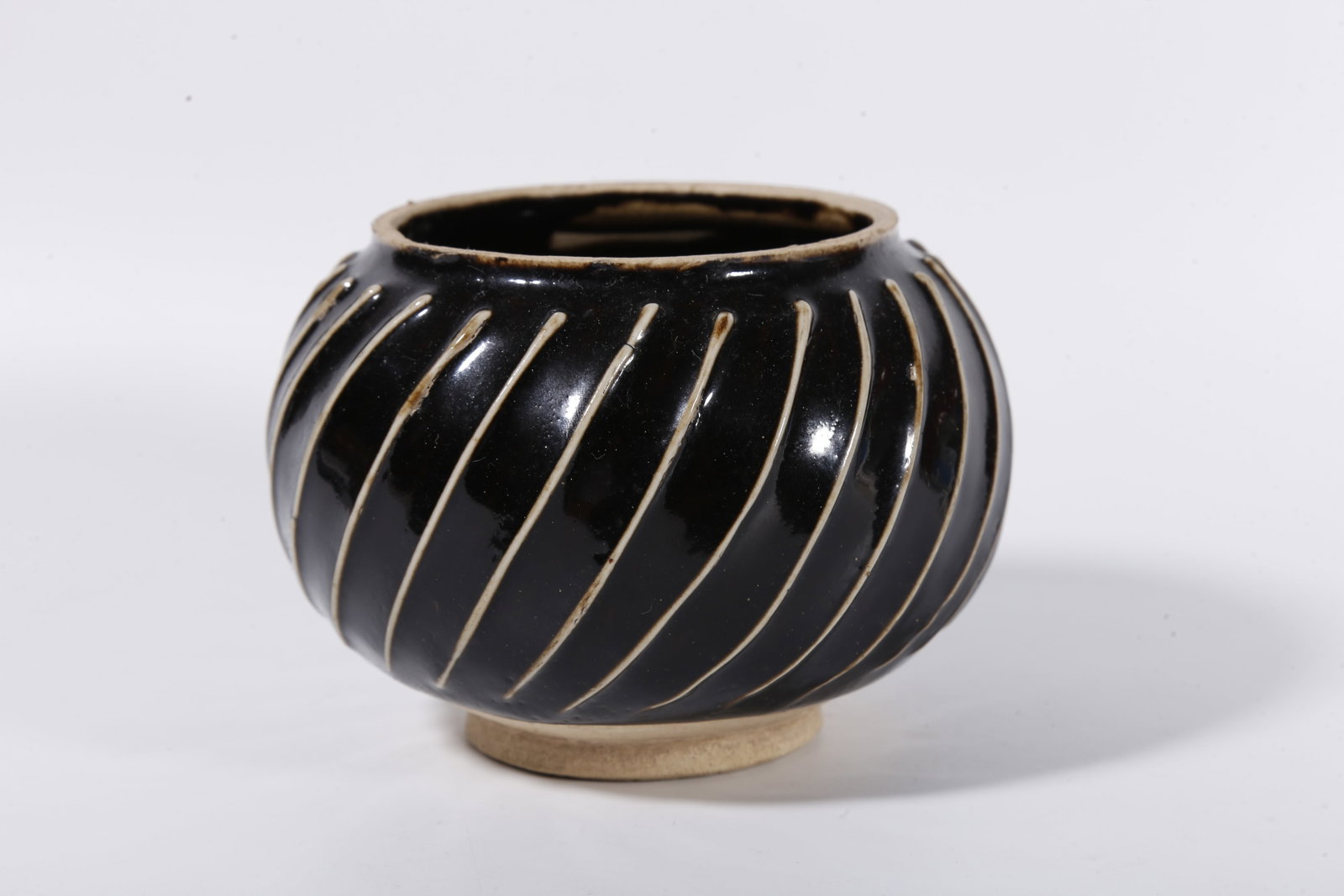 A DING KILN JAR WITH STRING PATTERNS - 2
