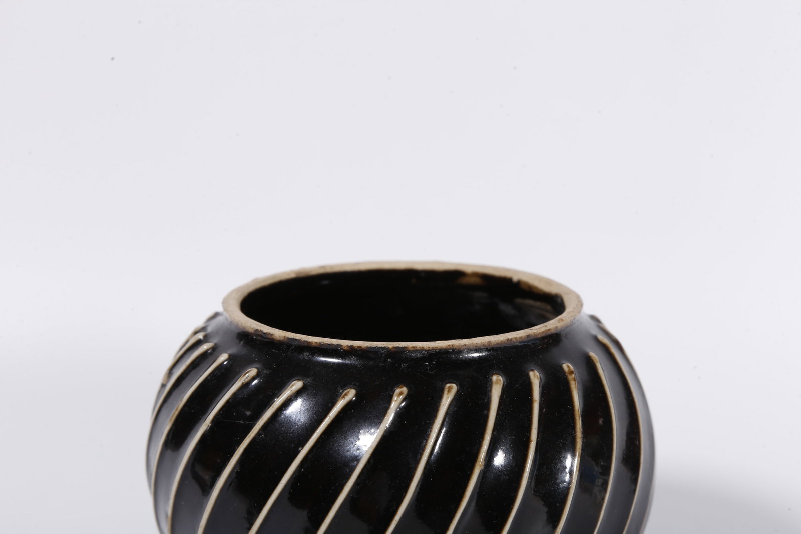 A DING KILN JAR WITH STRING PATTERNS - 5
