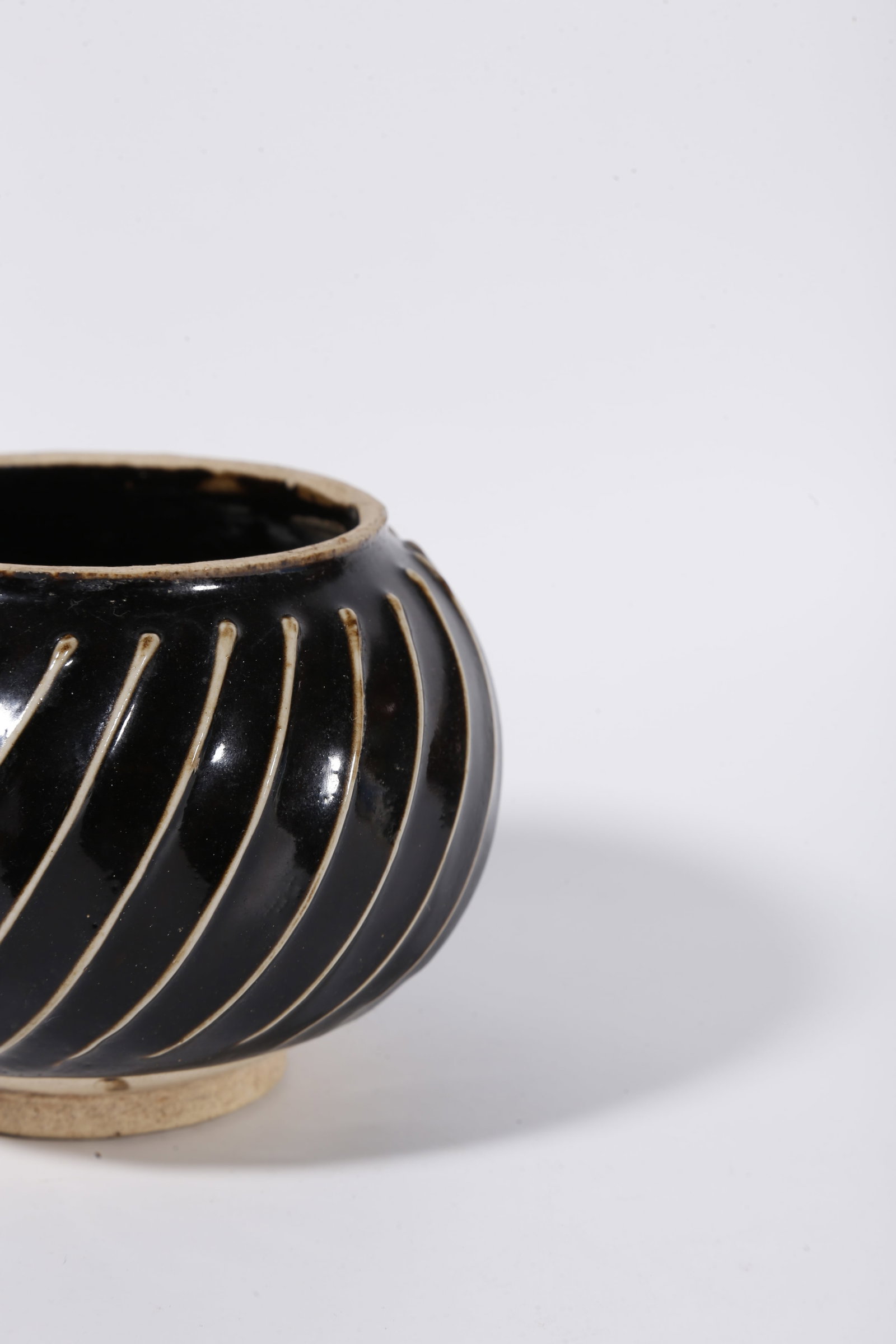 A DING KILN JAR WITH STRING PATTERNS - 7
