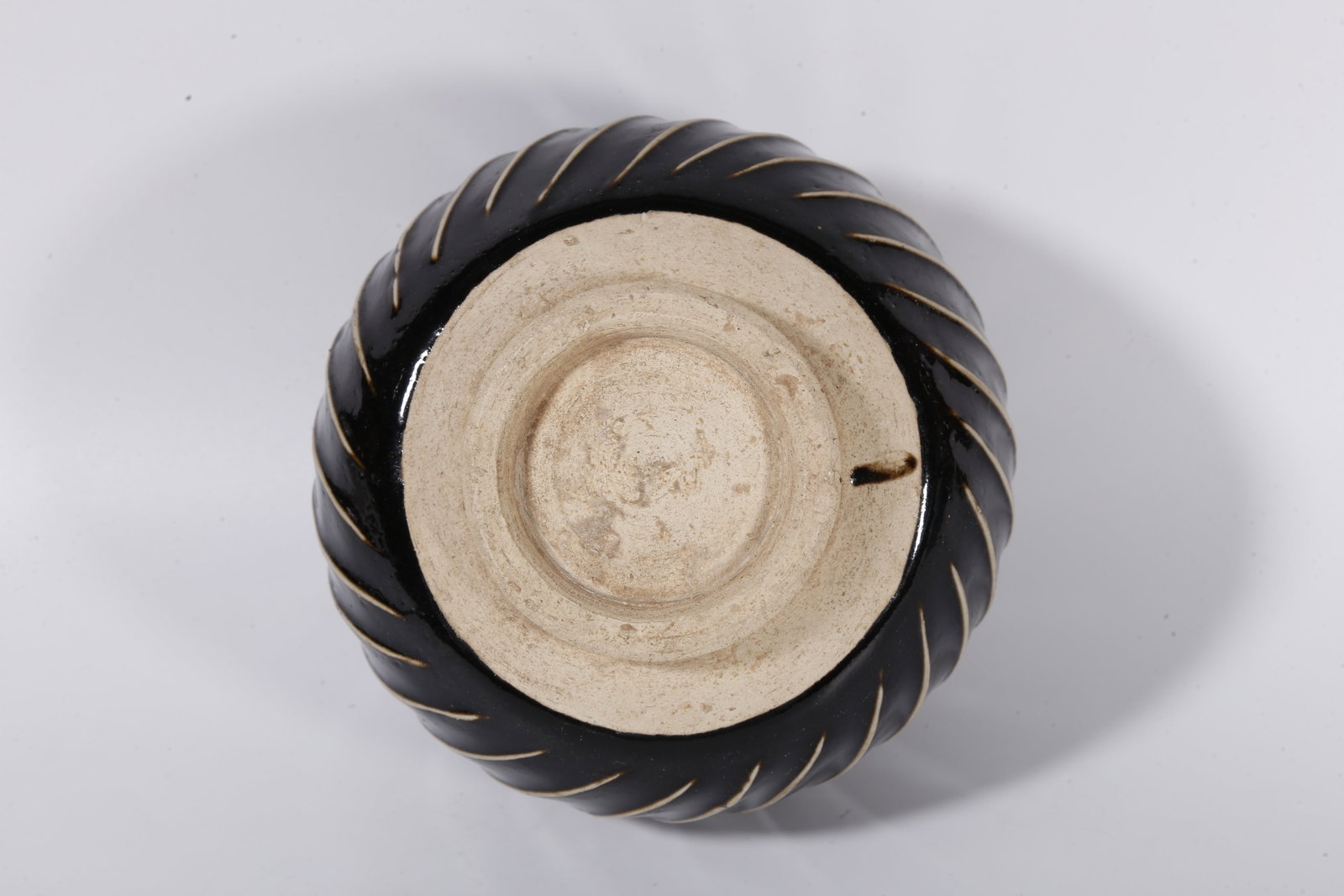 A DING KILN JAR WITH STRING PATTERNS - 9