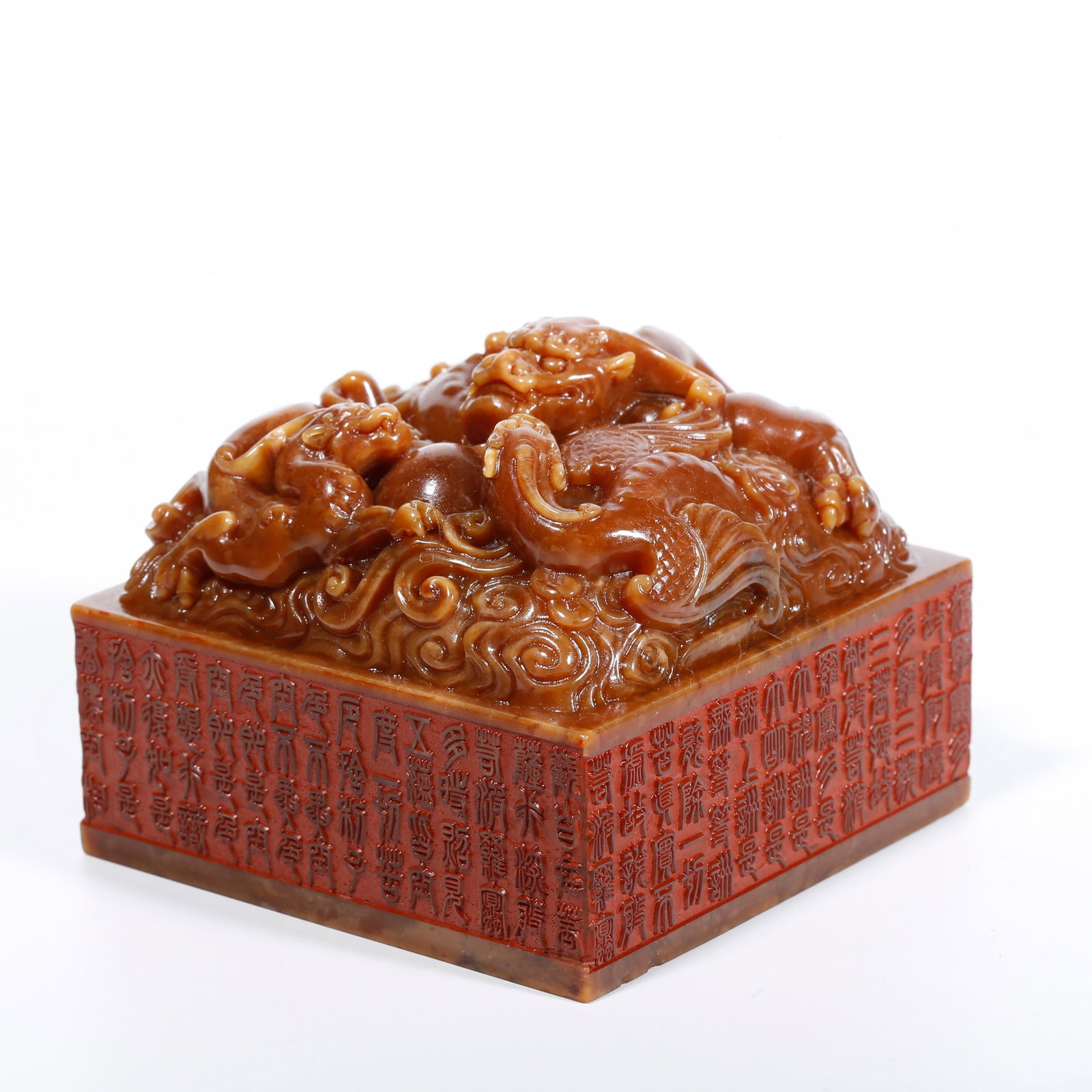 A SHOUSHAN TIANHUANG STONE SEAL CARVED WITH THREE-DRAGON PATTERN: Shoushan Tianhuang Stone Seal Carved with Three-Dragon Pattern