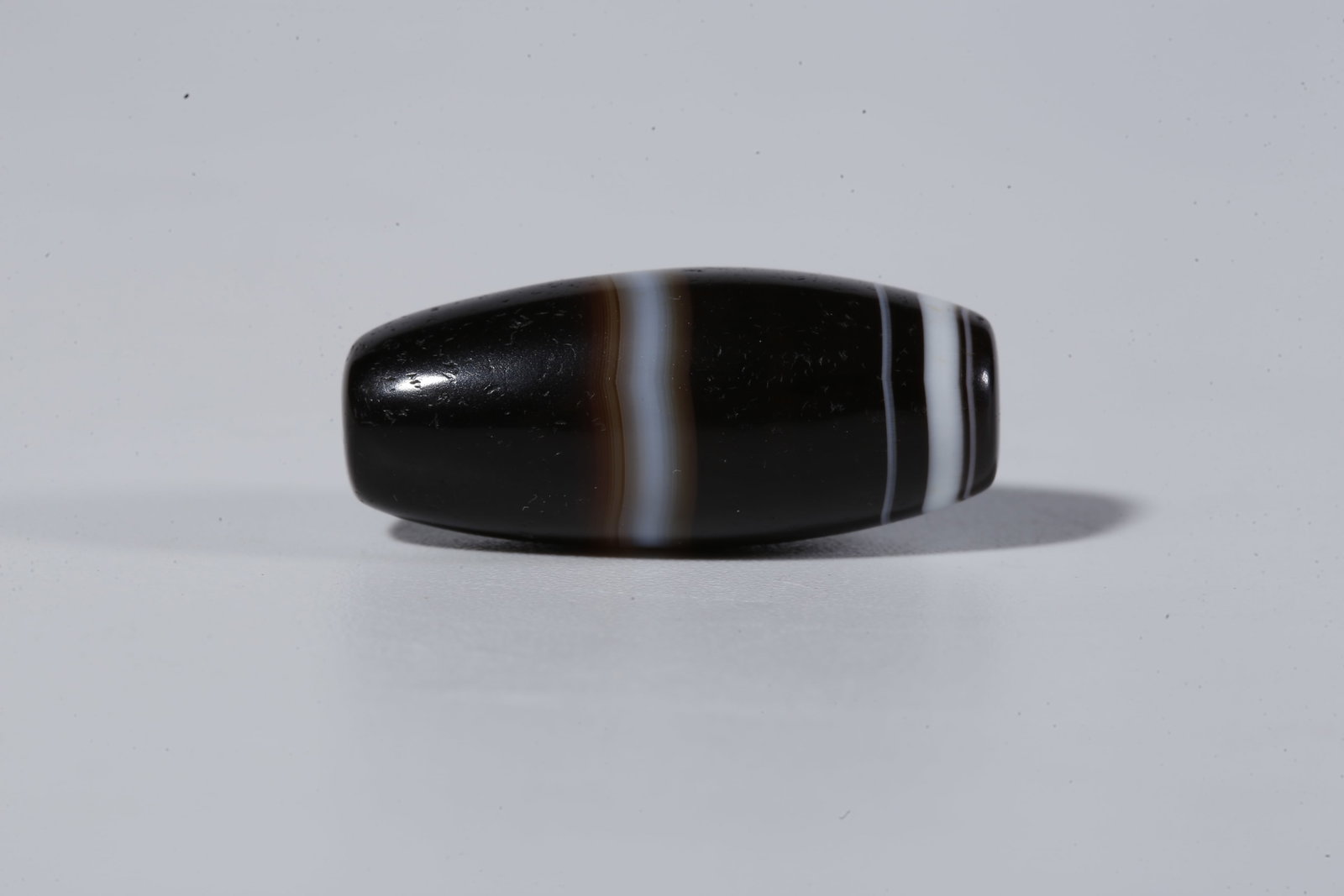A THREAD-WRAPPED AGATE DZI BEAD - 2