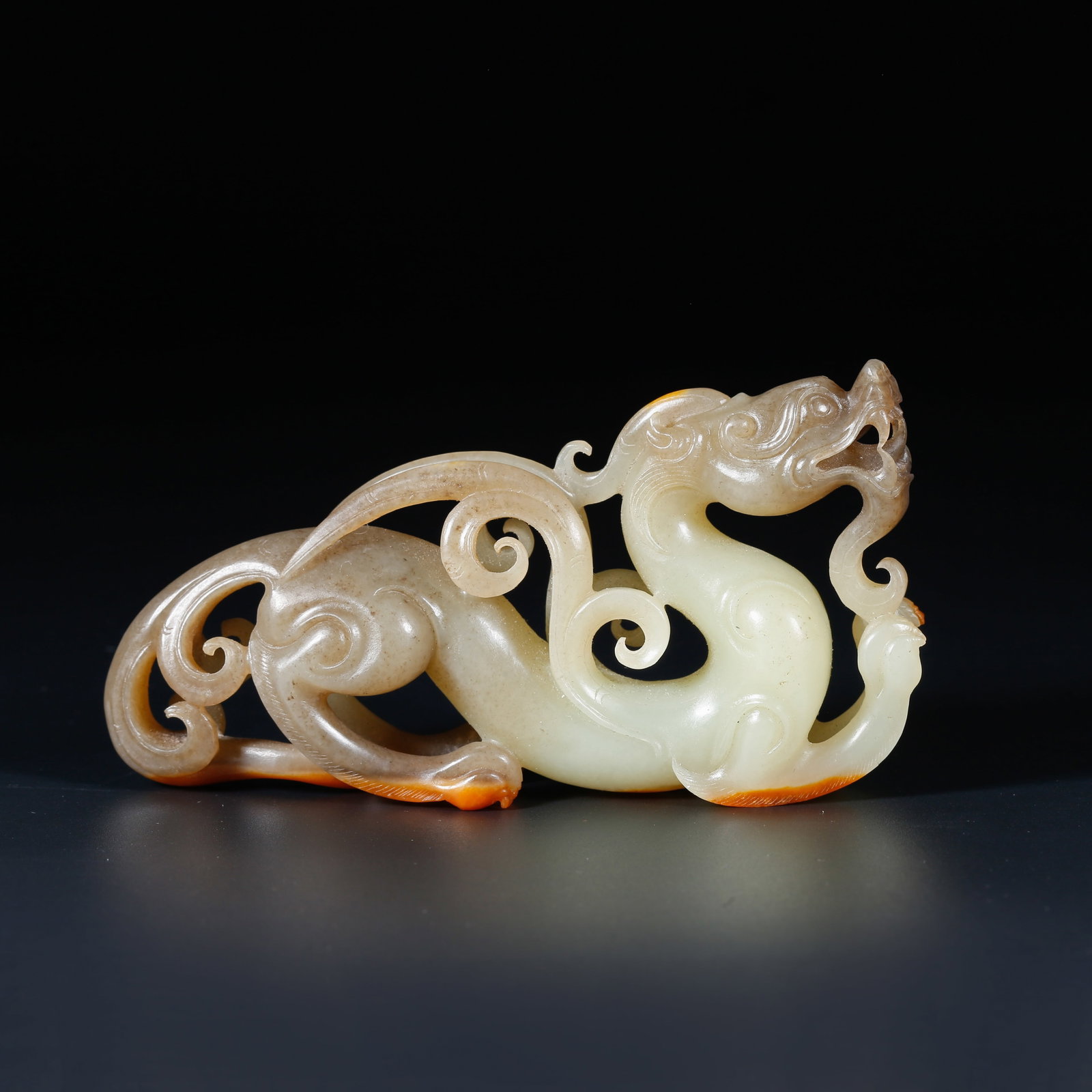 A HETIAN JADE ORNAMENT CARVED IN DRAGON SHAPE (1 of 9)