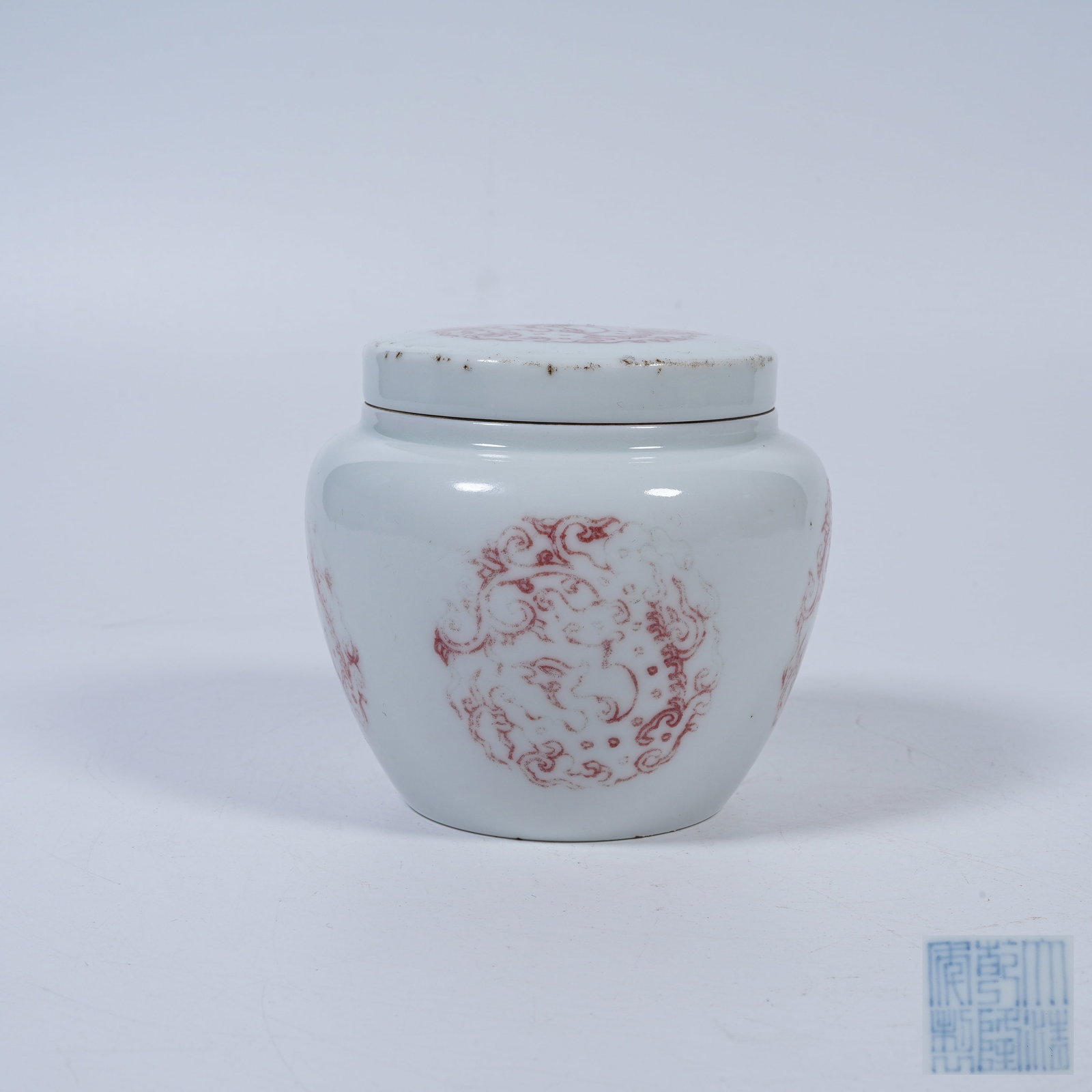 A IRON-RED COVERED JAR WITH CIRCULAR BEAST MEDALLION PATTERNS (1 of 9)