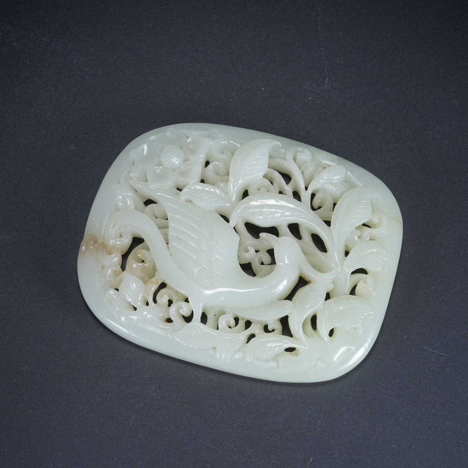 A HETIAN JADE PENDANT WITH PHOENIX AND FLORAL PATTERN: Hetian Jade Pendant with Phoenix and Floral Pattern