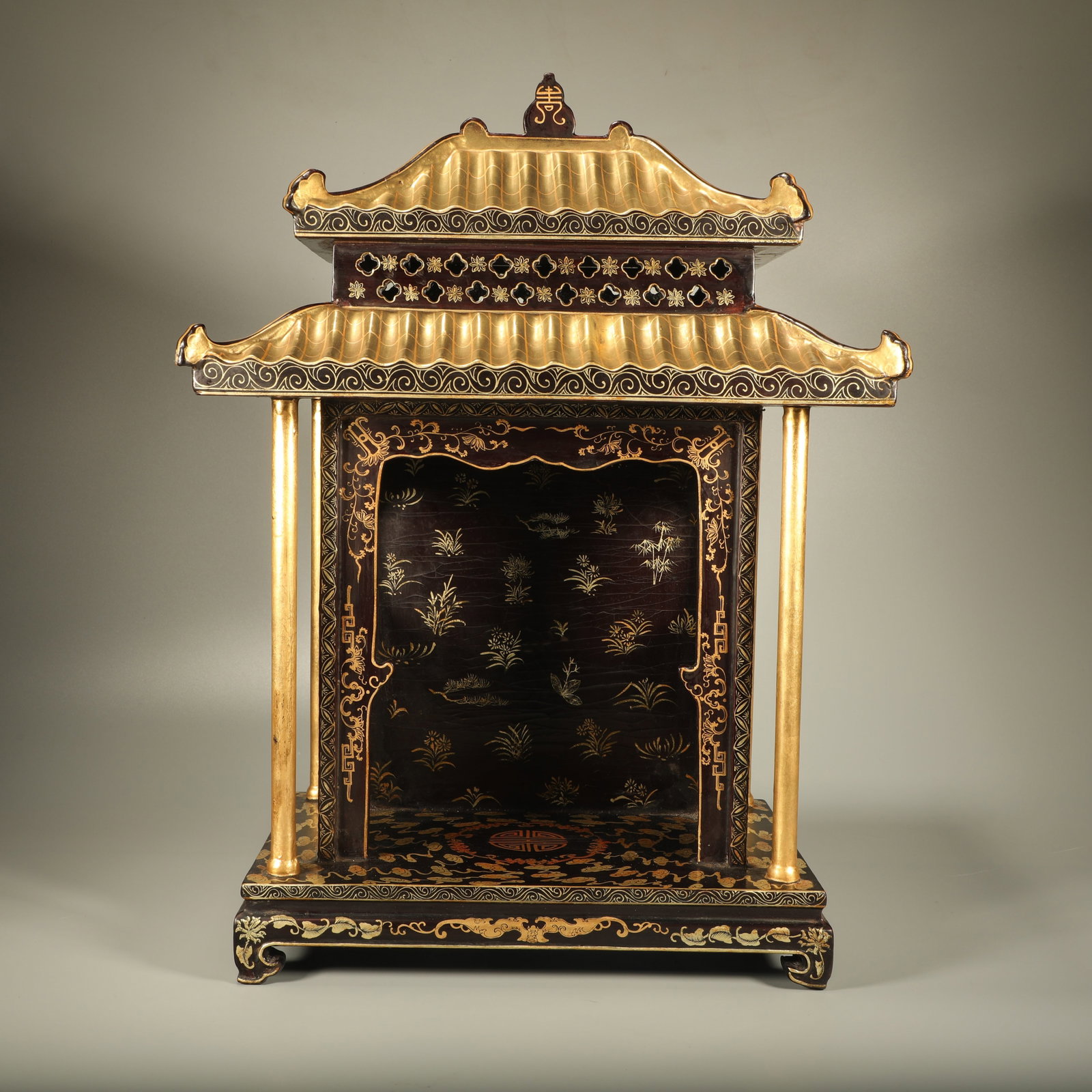 A LACQUER BUDDHA NICHE DECORATED WITH GILDED FLORAL AND CLOUD PATTERNS: Lacquer Buddha Niche Decorated with Gilded Floral and Cloud Patterns