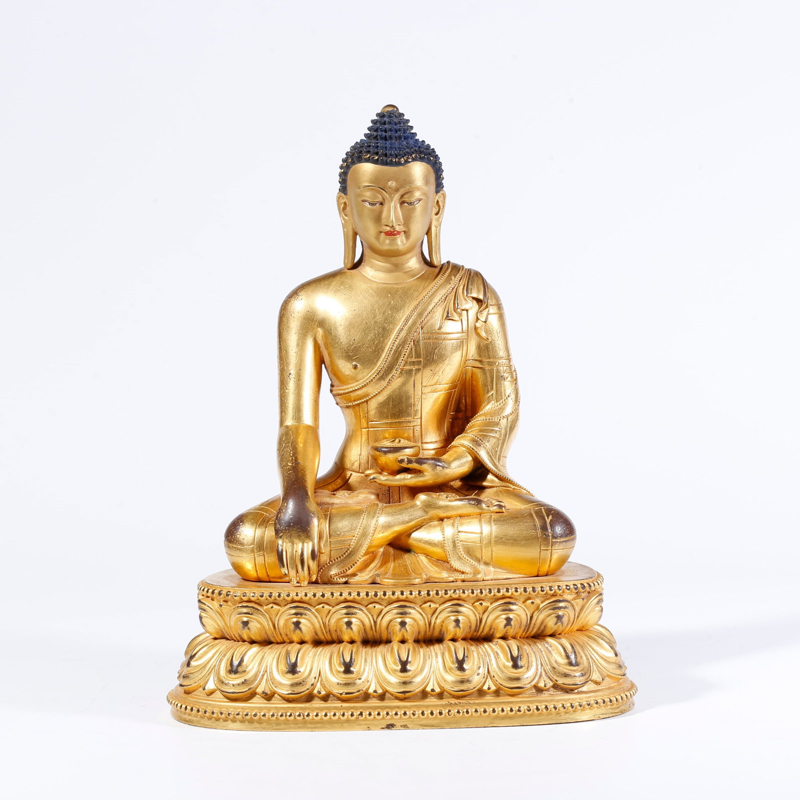 A GILT-BRONZE SHAKYAMUNI BUDDHA FIGURE (1 of 9)