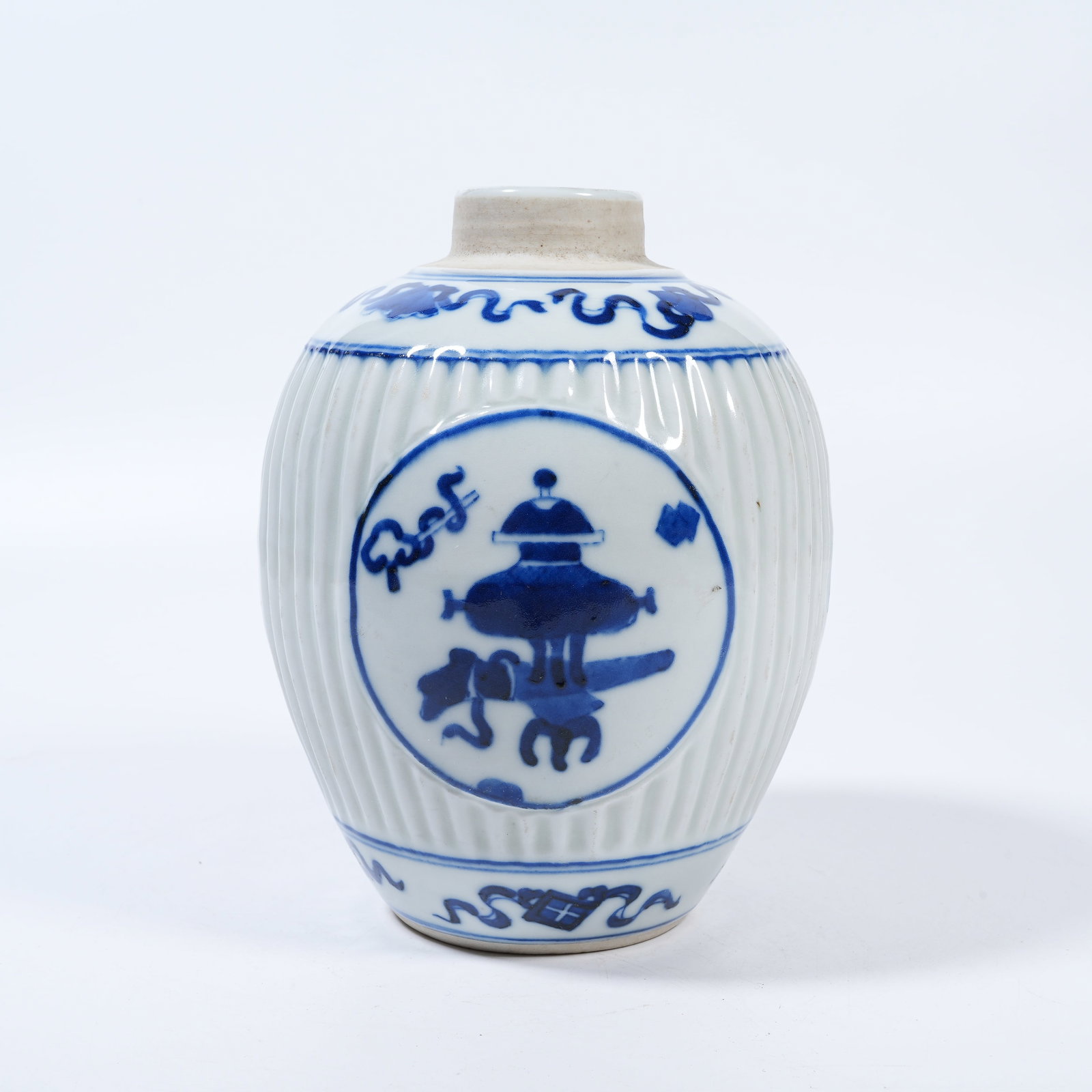 A BLUE AND WHITE JAR WITH ANTIQUE CURIOS PATTERN: Blue and White Jar with Antique Curios Pattern