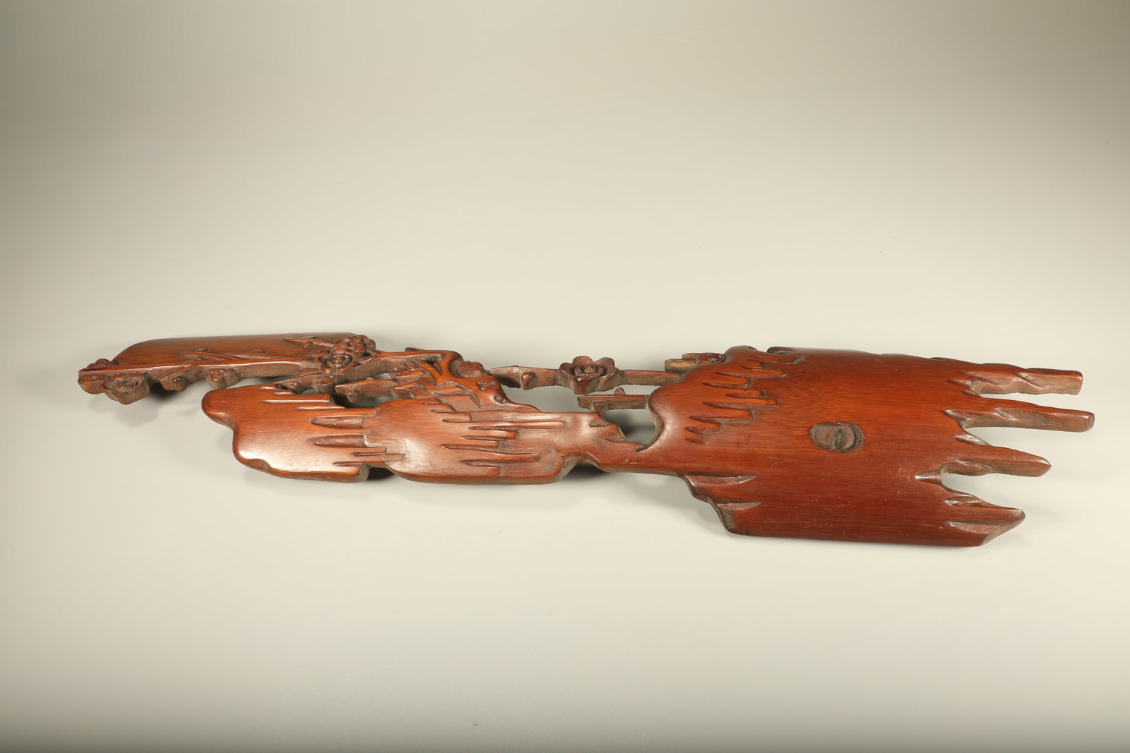 A BAMBOO CARVED ARM REST WITH PLUM BLOSSOM MOTIFS: Bamboo Carved Arm Rest with Plum Blossom Motifs