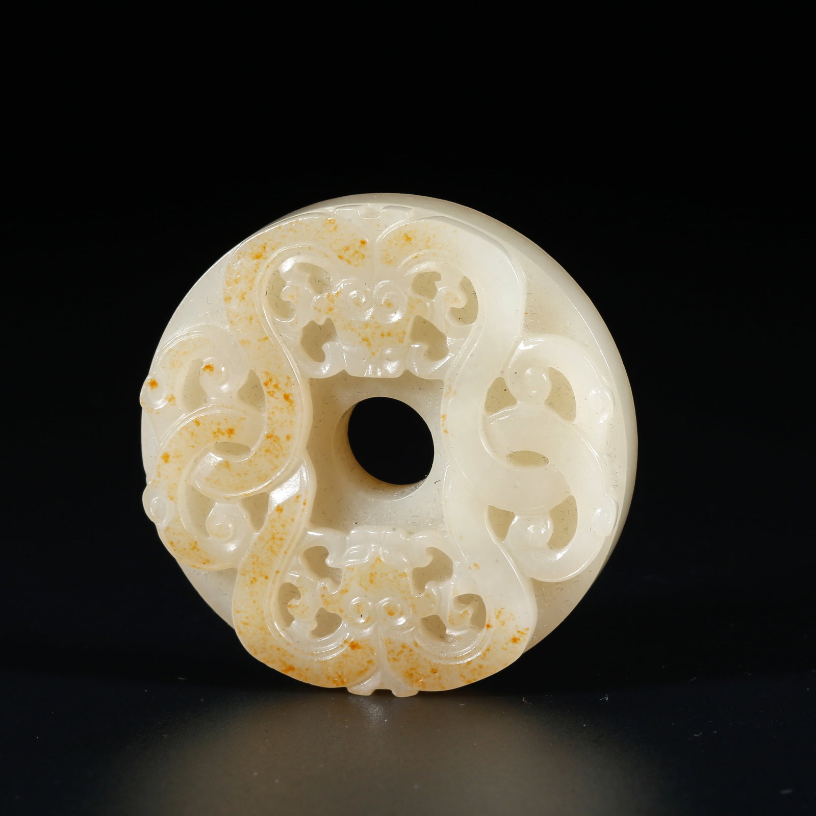 A HETIAN JADE BI DISC CARVED WITH DRAGON PATTERNS: Hetian Jade Bi Disc Carved with Dragon Patterns