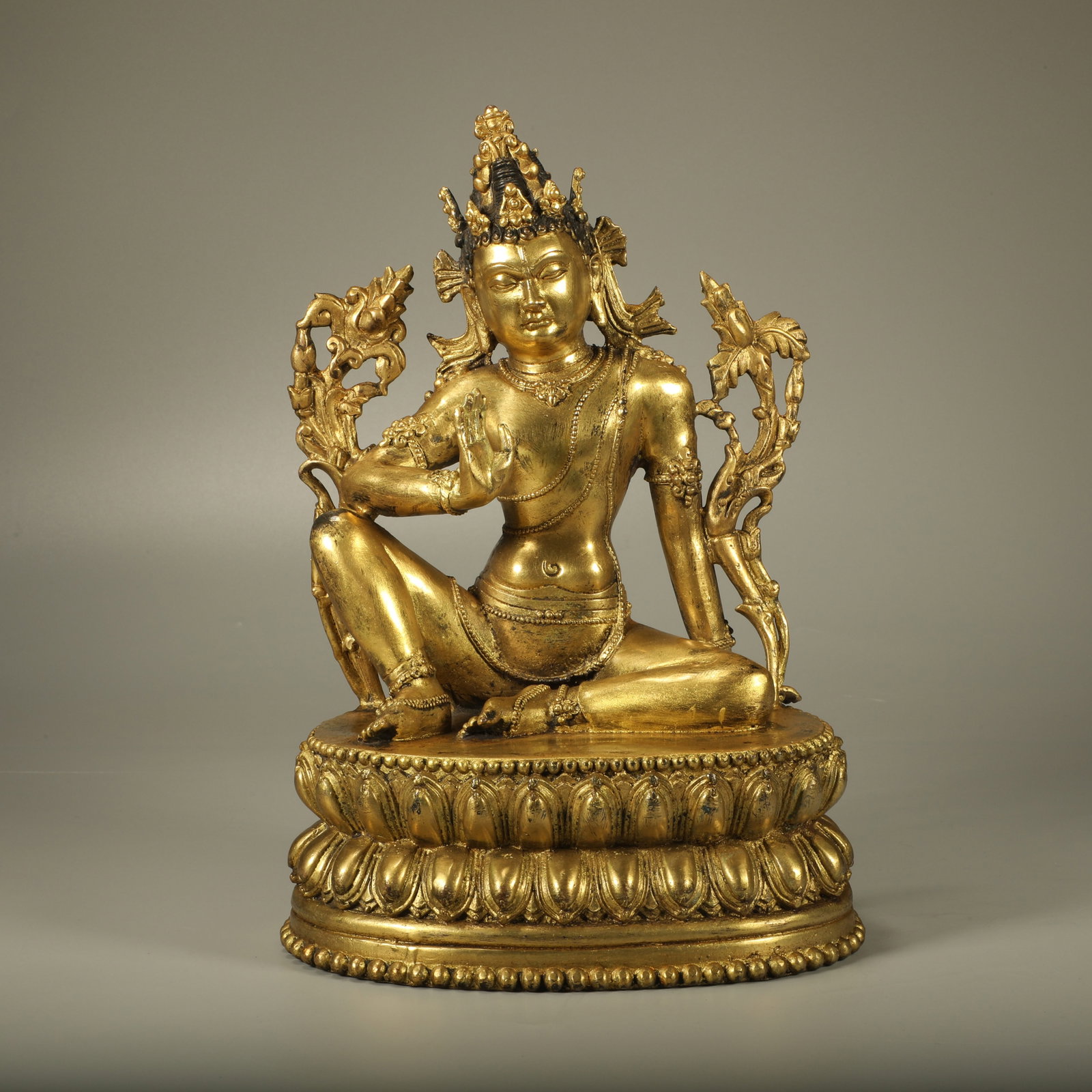 A GILDED BRONZE STATUE OF GUANYIN WITH LOTUS HANDS: Gilded Bronze Statue of Guanyin with Lotus Hands